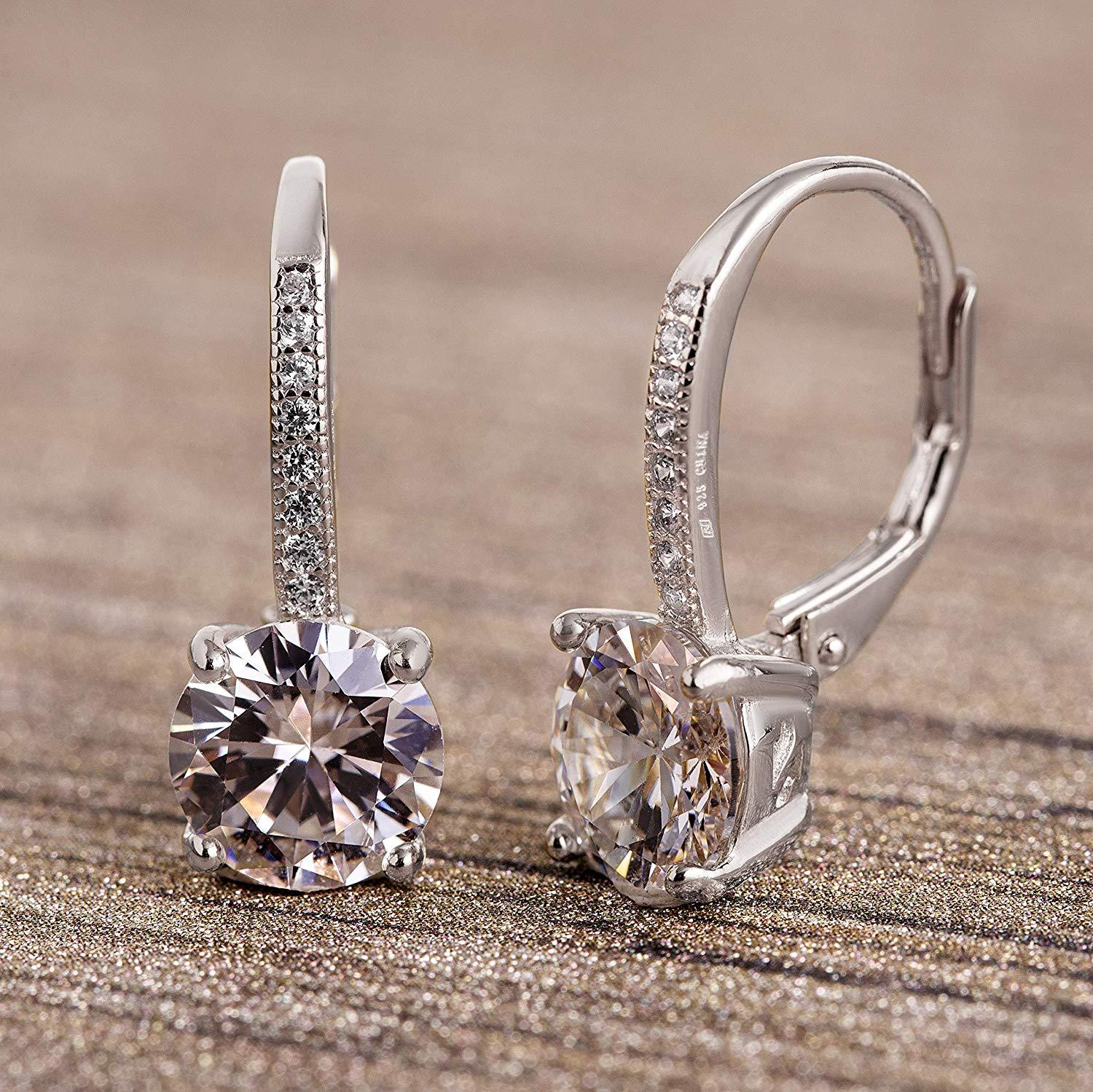 Elegant Pave Leverback Earrings in 18K Gold featuring sparkling Elements, available in white, yellow, and rose gold tones.