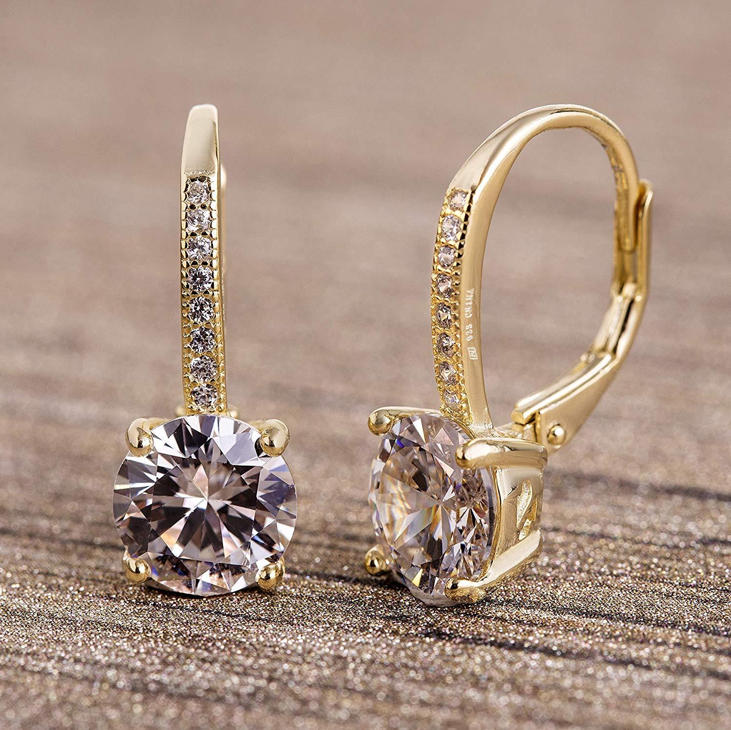 Elegant Pave Leverback Earrings in 18K Gold featuring sparkling Elements, available in white, yellow, and rose gold tones.