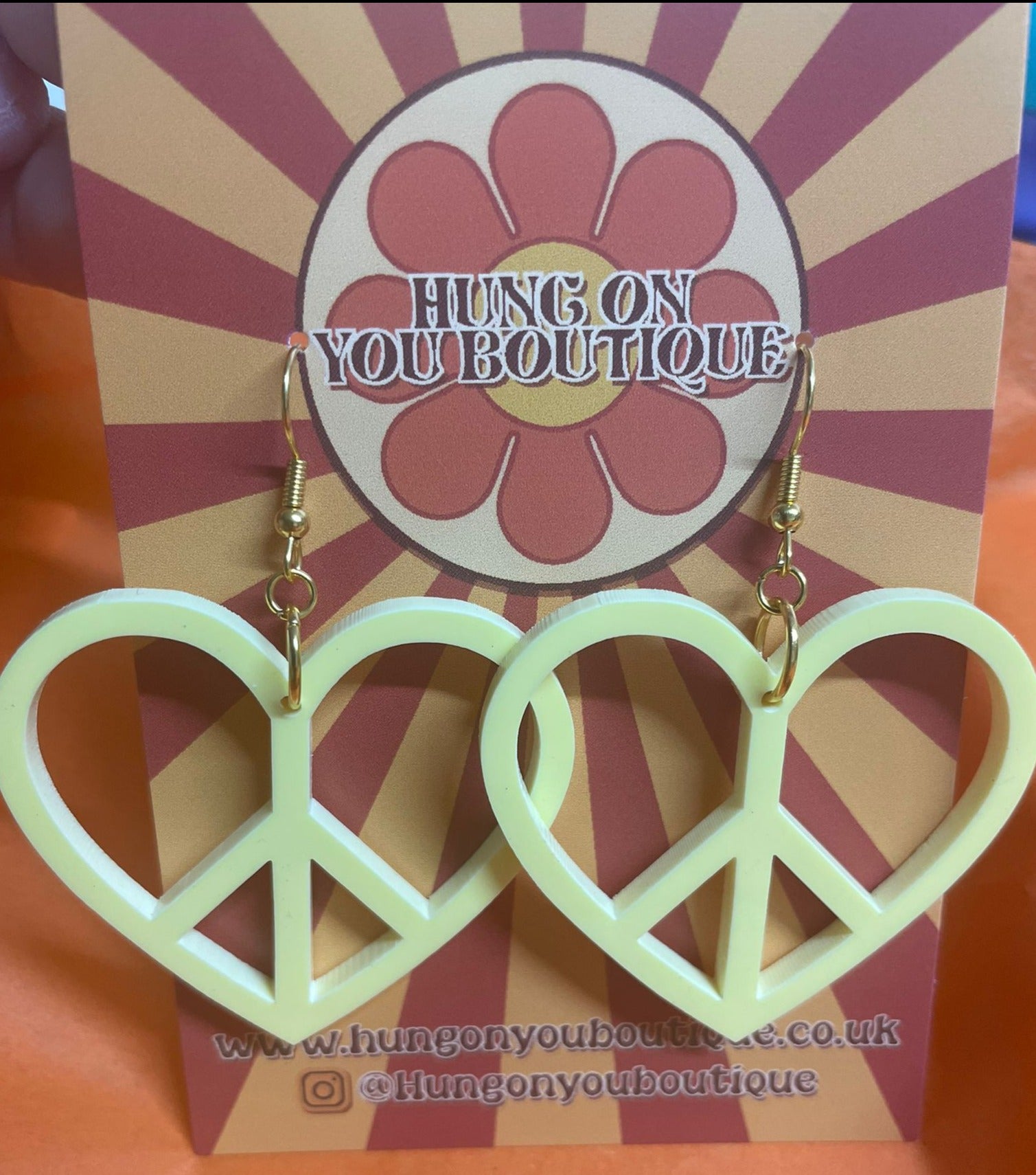 Colorful Peace Heart Earrings made from laser-cut acrylic, showcasing a heart shape with a peace symbol design.