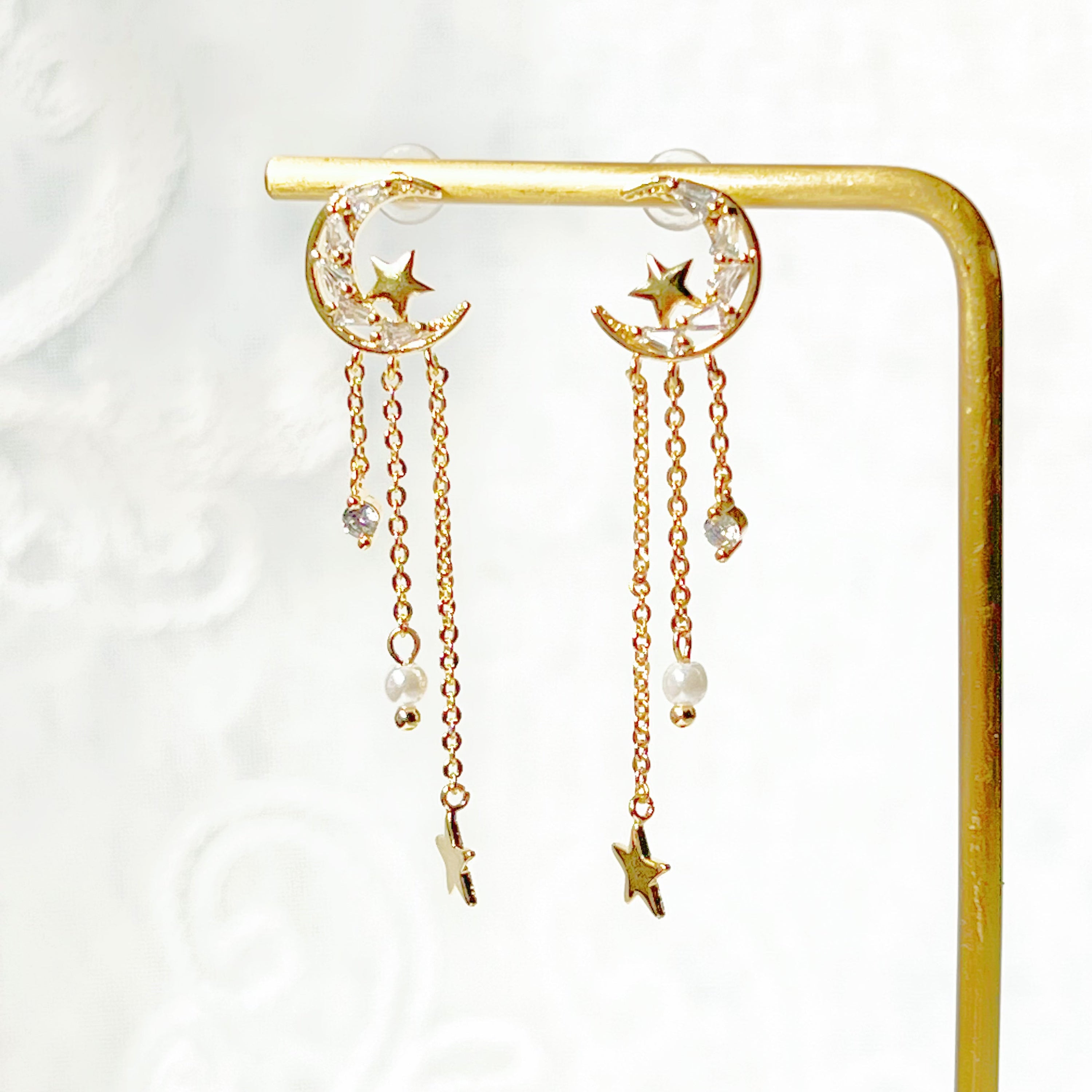 Elegant Peaceful Night Moon and Stars Drop Earrings featuring zircon crystals and gold plated bronze base.