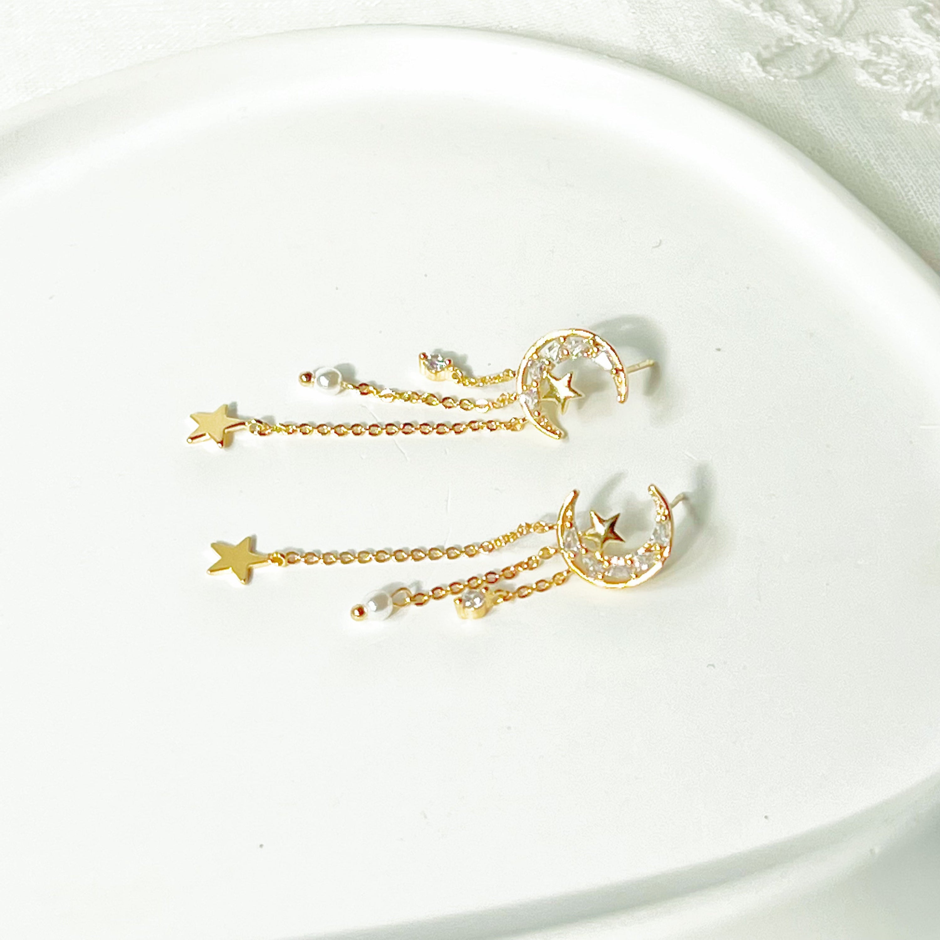 Elegant Peaceful Night Moon and Stars Drop Earrings featuring zircon crystals and gold plated bronze base.