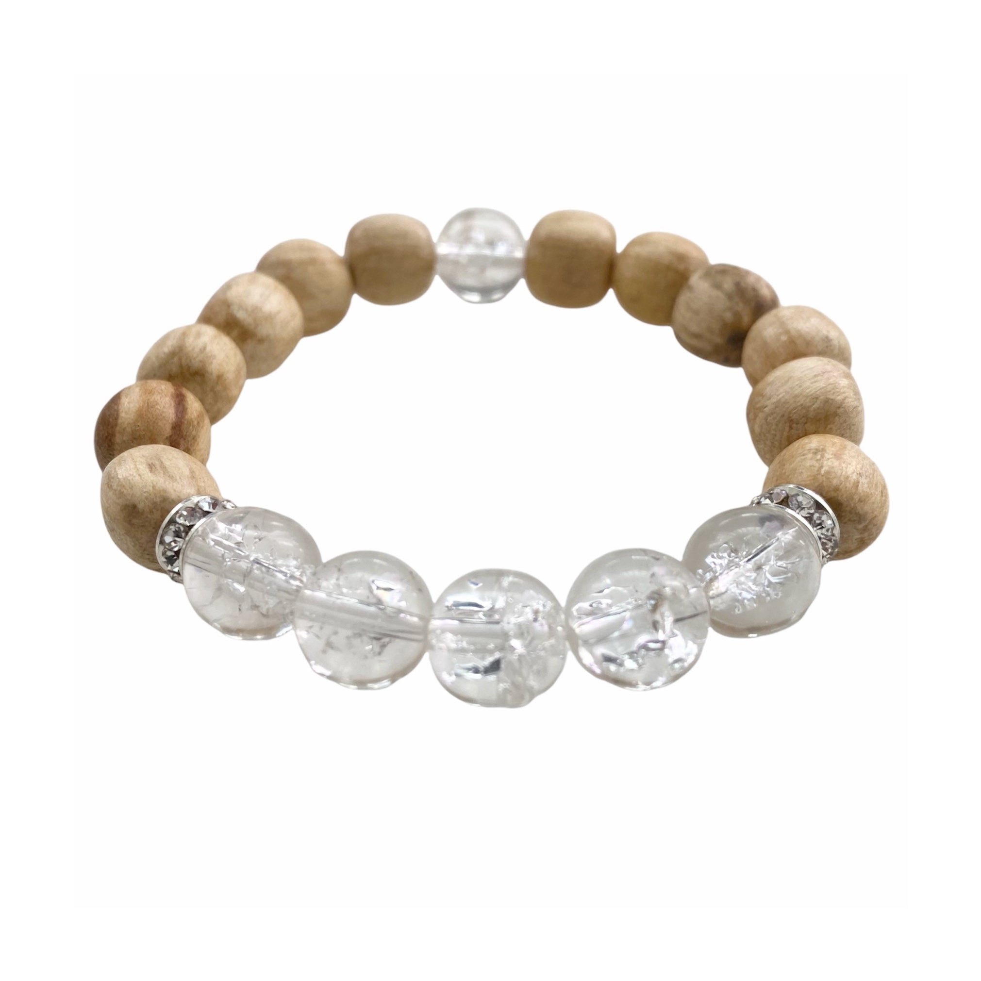 A handmade beaded bracelet featuring 10mm cracked quartz beads and palo santo, designed for meditation and stress relief.