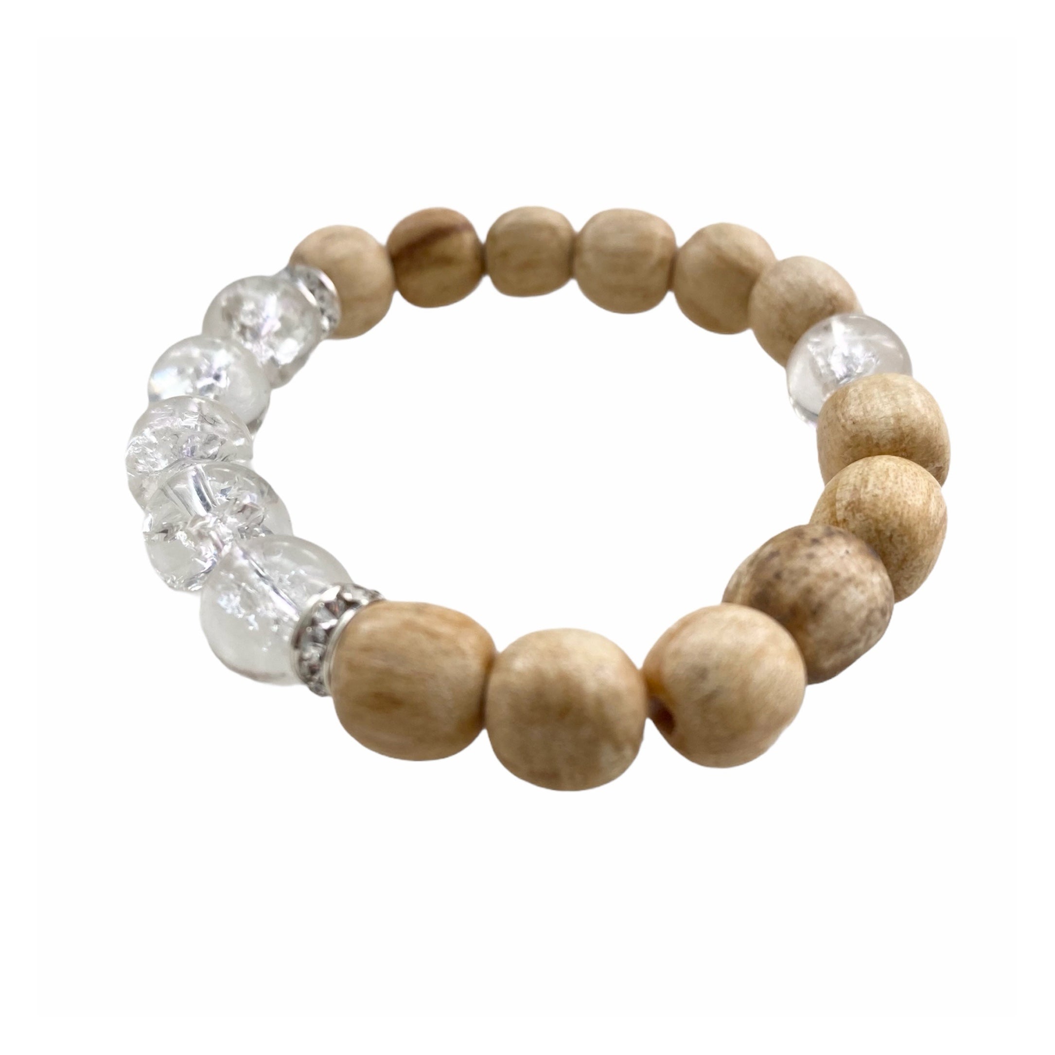 A handmade beaded bracelet featuring 10mm cracked quartz beads and palo santo, designed for meditation and stress relief.