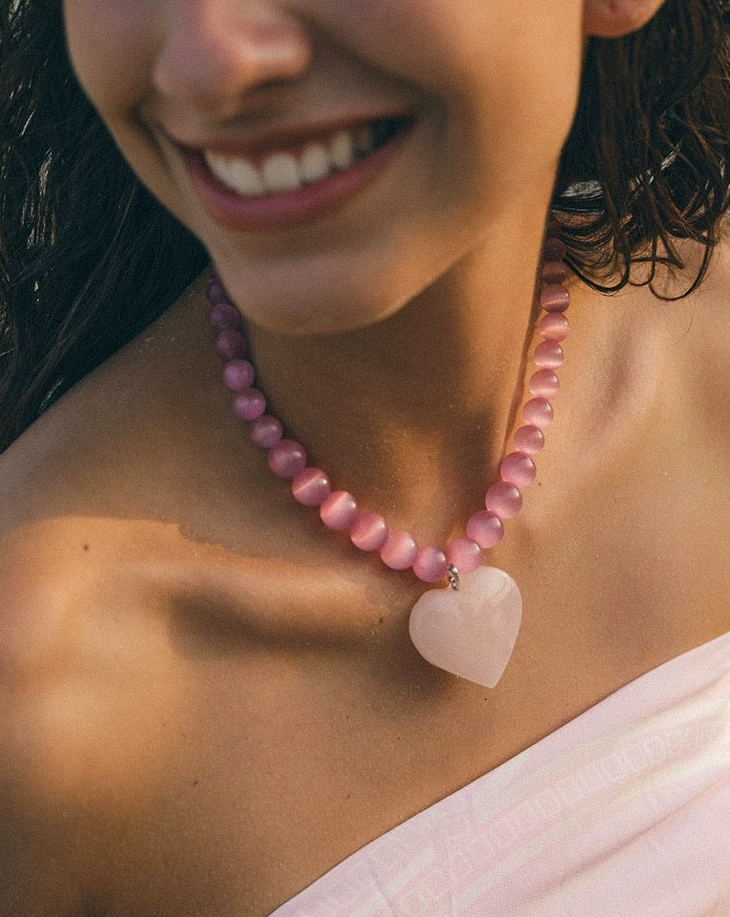 Peach Blossom Juicy Pink Cat's Eye Necklace featuring delicate pink stones, elegantly designed for summer fashion.