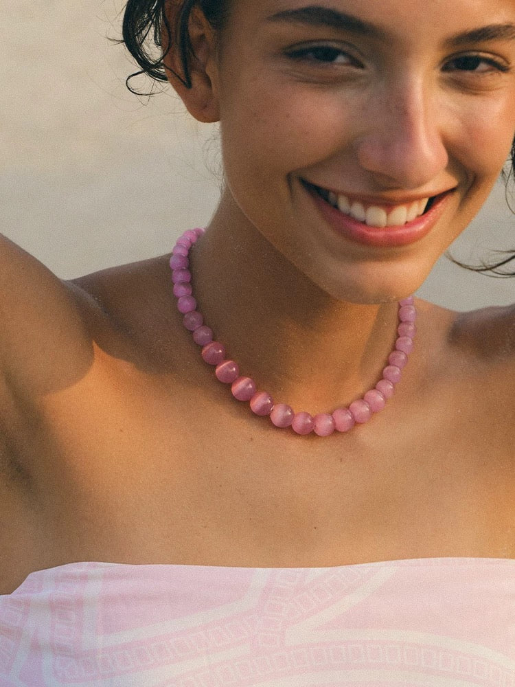 Peach Blossom Juicy Pink Cat's Eye Necklace featuring delicate pink stones, elegantly designed for summer fashion.