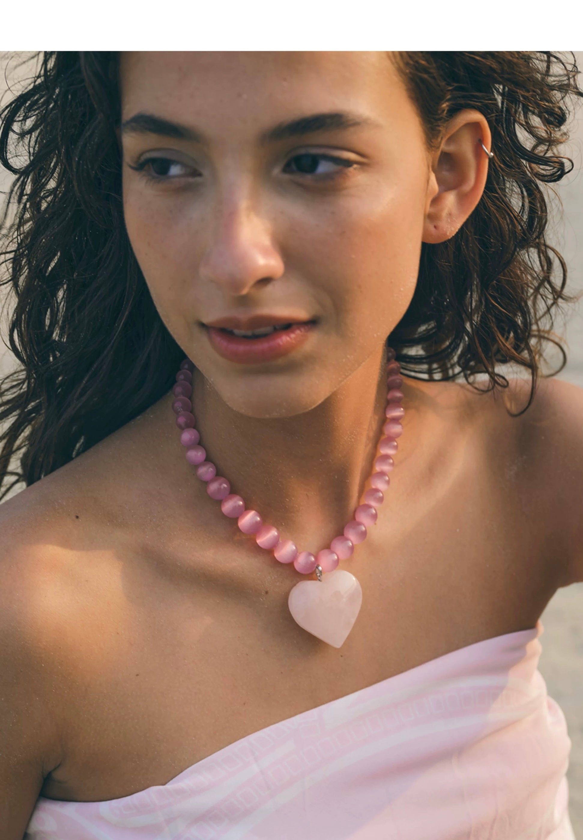 Peach Blossom Juicy Pink Cat's Eye Necklace featuring delicate pink stones, elegantly designed for summer fashion.