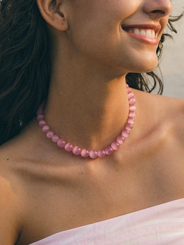 Peach Blossom Juicy Pink Cat's Eye Necklace featuring delicate pink stones, elegantly designed for summer fashion.