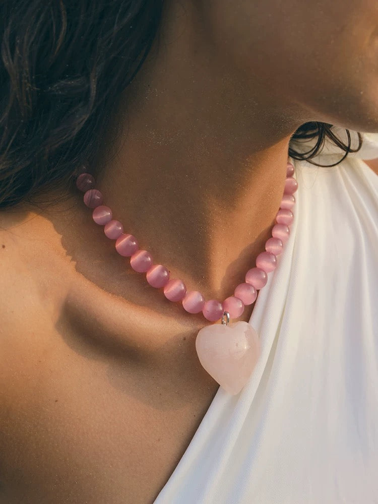 Peach Blossom Juicy Pink Cat's Eye Necklace featuring delicate pink stones, elegantly designed for summer fashion.