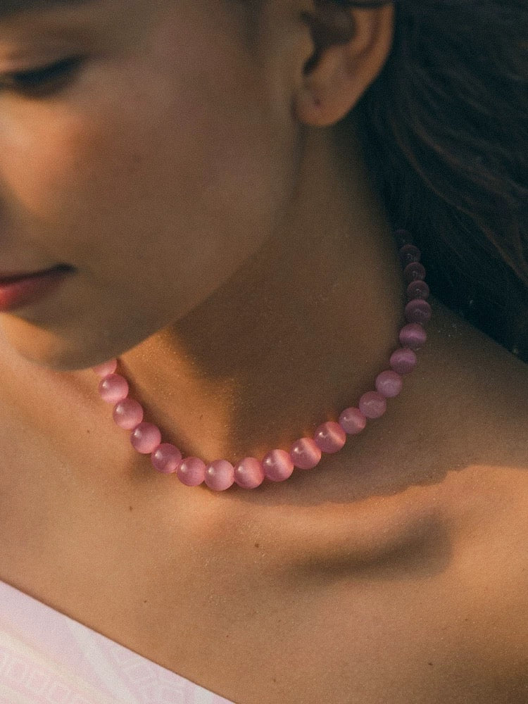 Peach Blossom Juicy Pink Cat's Eye Necklace featuring delicate pink stones, elegantly designed for summer fashion.