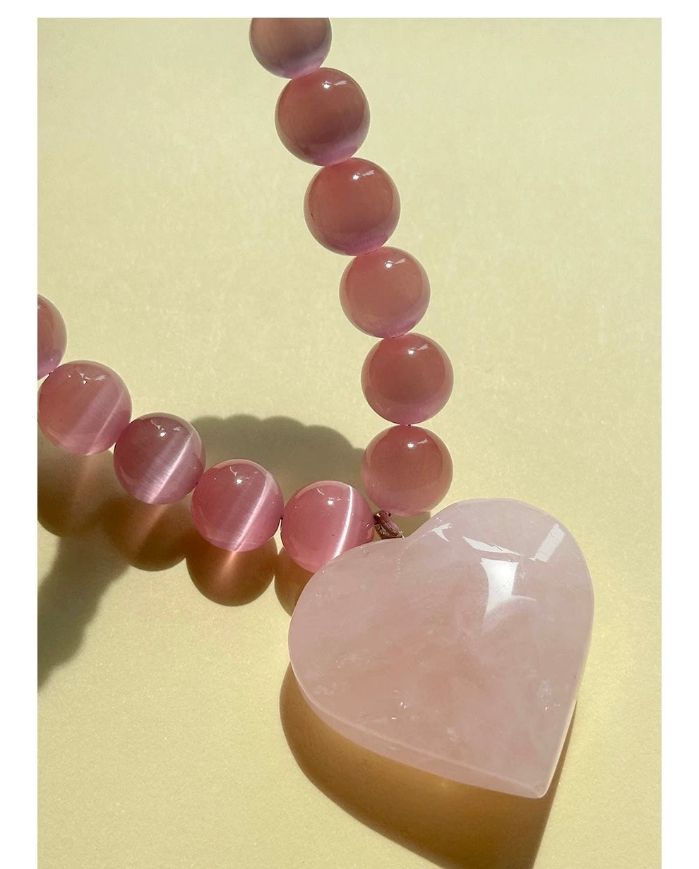 Peach Blossom Juicy Pink Cat's Eye Necklace featuring delicate pink stones, elegantly designed for summer fashion.