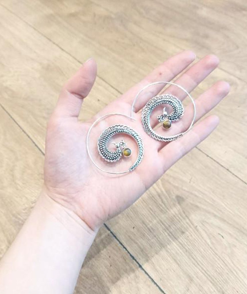 A pair of elegant Peacock Swirl Earrings made from brass and silver, featuring a unique swirl design, perfect for sensitive skin.