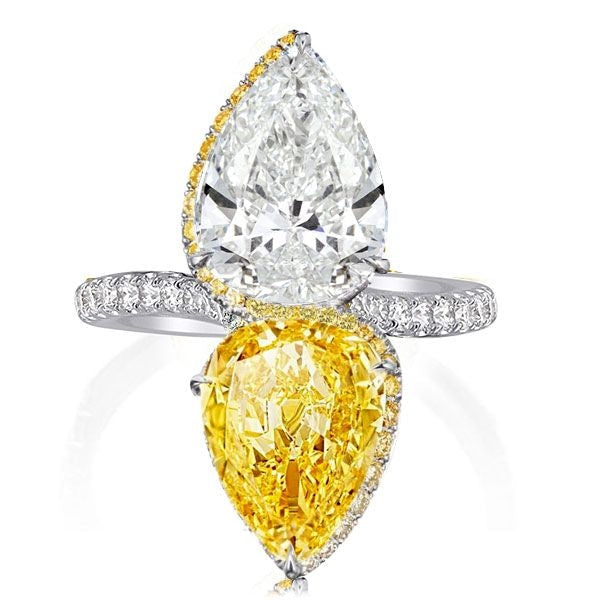 Elegant pear cut cocktail engagement ring made of sterling silver with white gold finish, featuring white sapphire and yellow citrine gemstones.