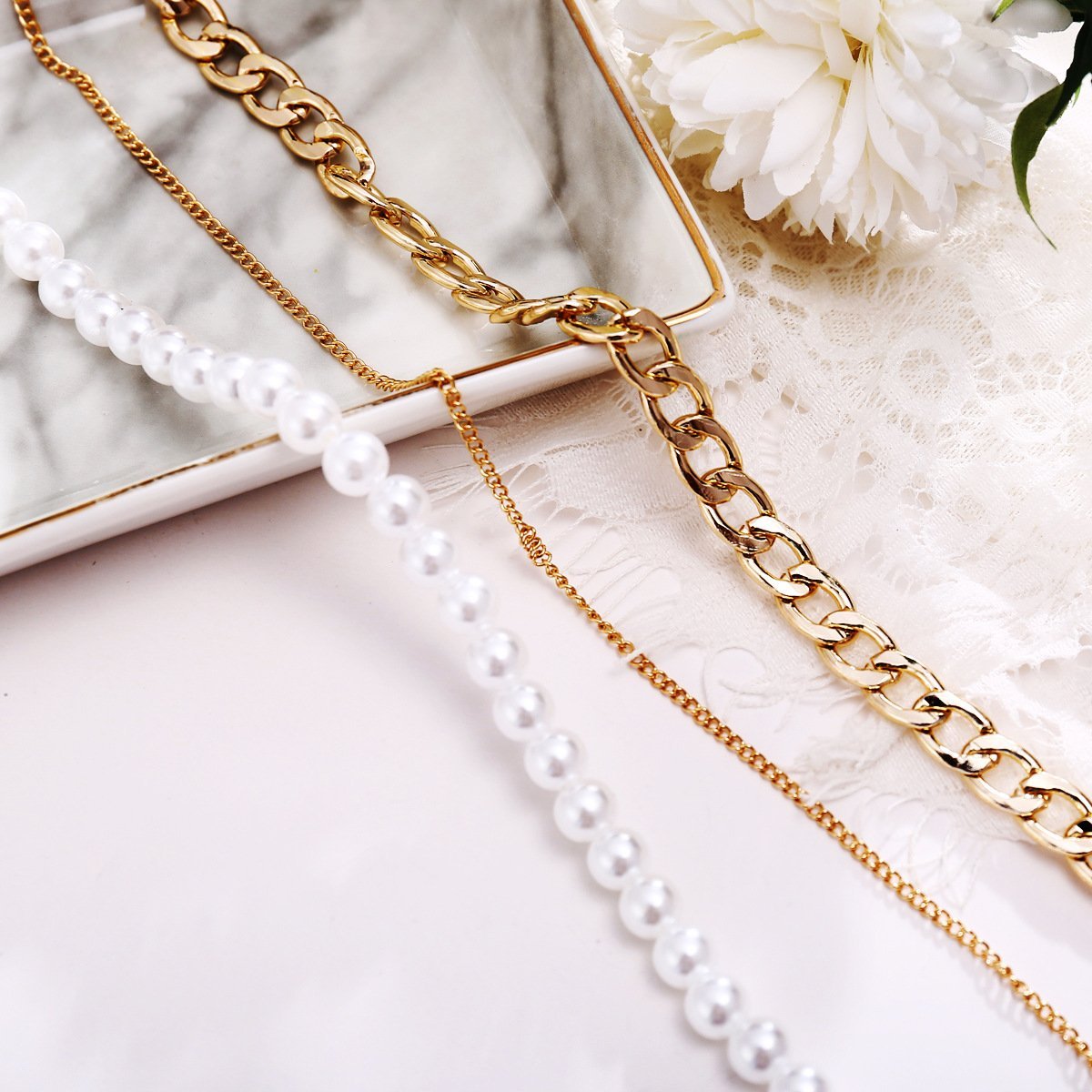 Elegant 18K gold plated necklace featuring pearl and curb link design, adjustable length with lobster clasp closure.