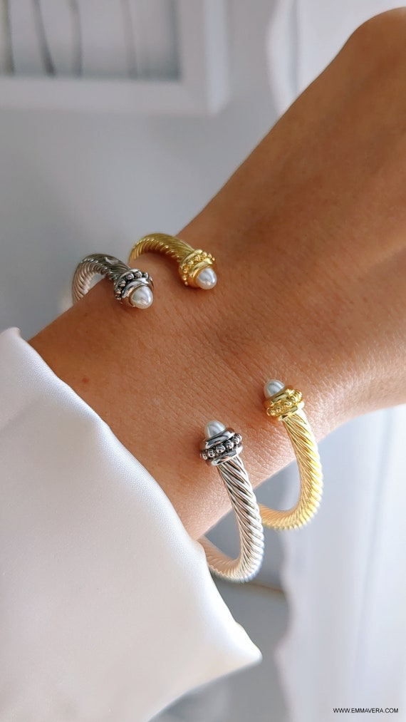 Elegant Pearl Bangle Bracelet with twisted cable design in gold and silver options, featuring a synthetic pearl accent.