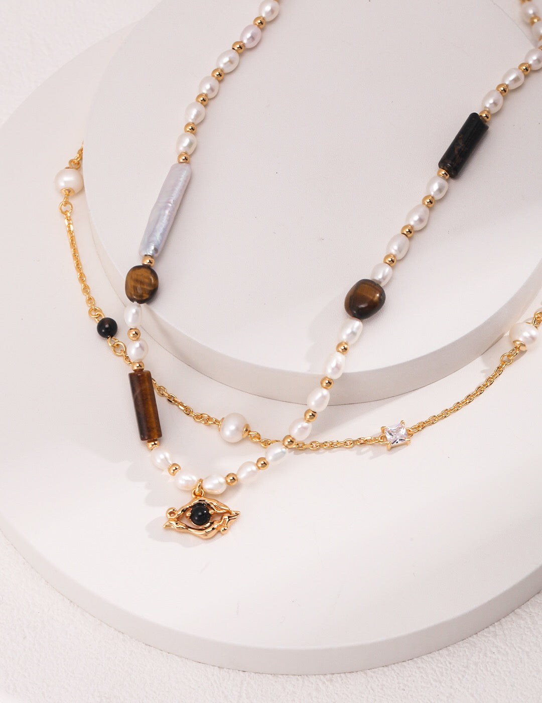 Elegant Pearl Black Onyx Cubic Zirconia Chain Necklace featuring black agate, freshwater pearls, and gold vermeil, showcasing its luxurious design.