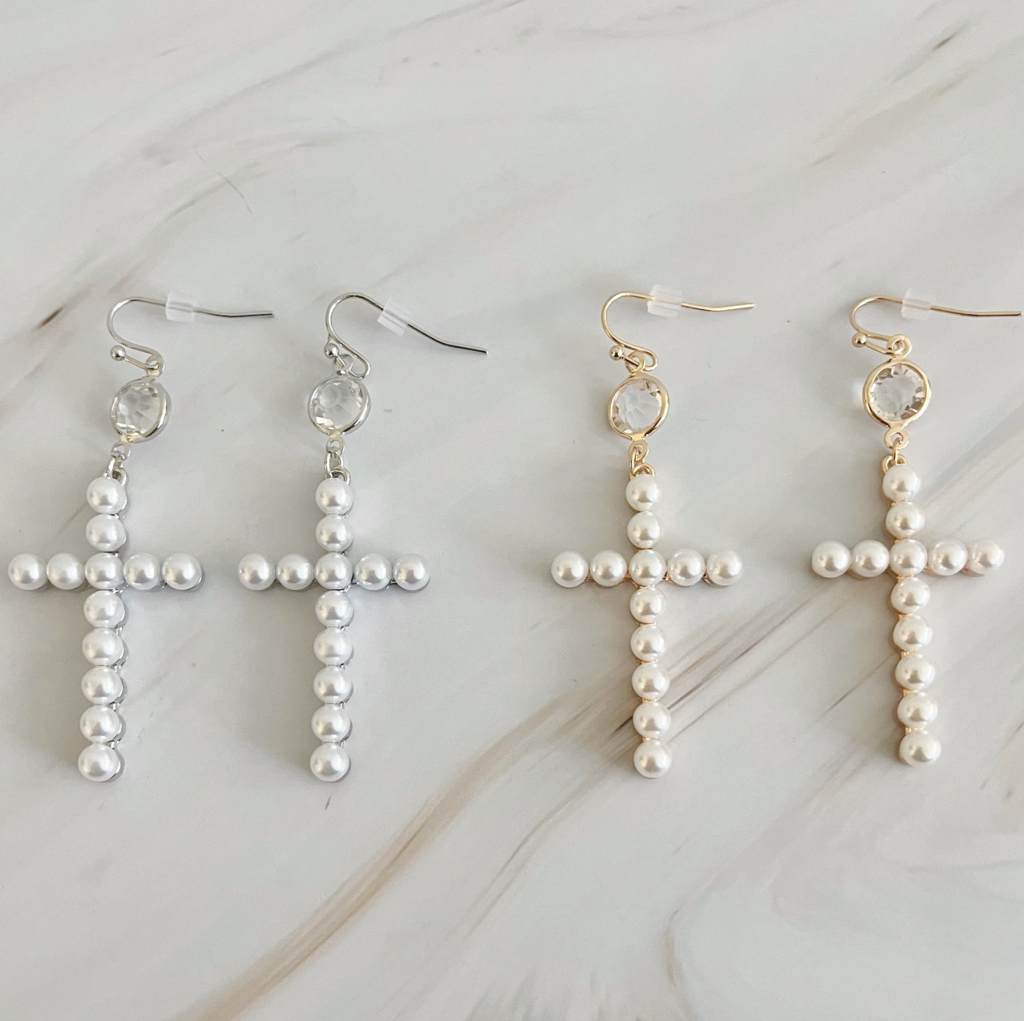 Elegant Pearl Cross Dangle Earrings featuring pearl accents and a unique cross design, perfect for any occasion.