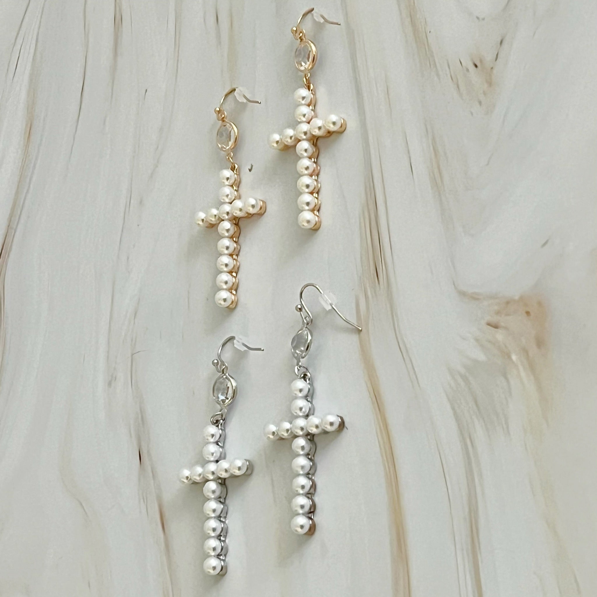 Elegant Pearl Cross Dangle Earrings featuring pearl accents and a unique cross design, perfect for any occasion.