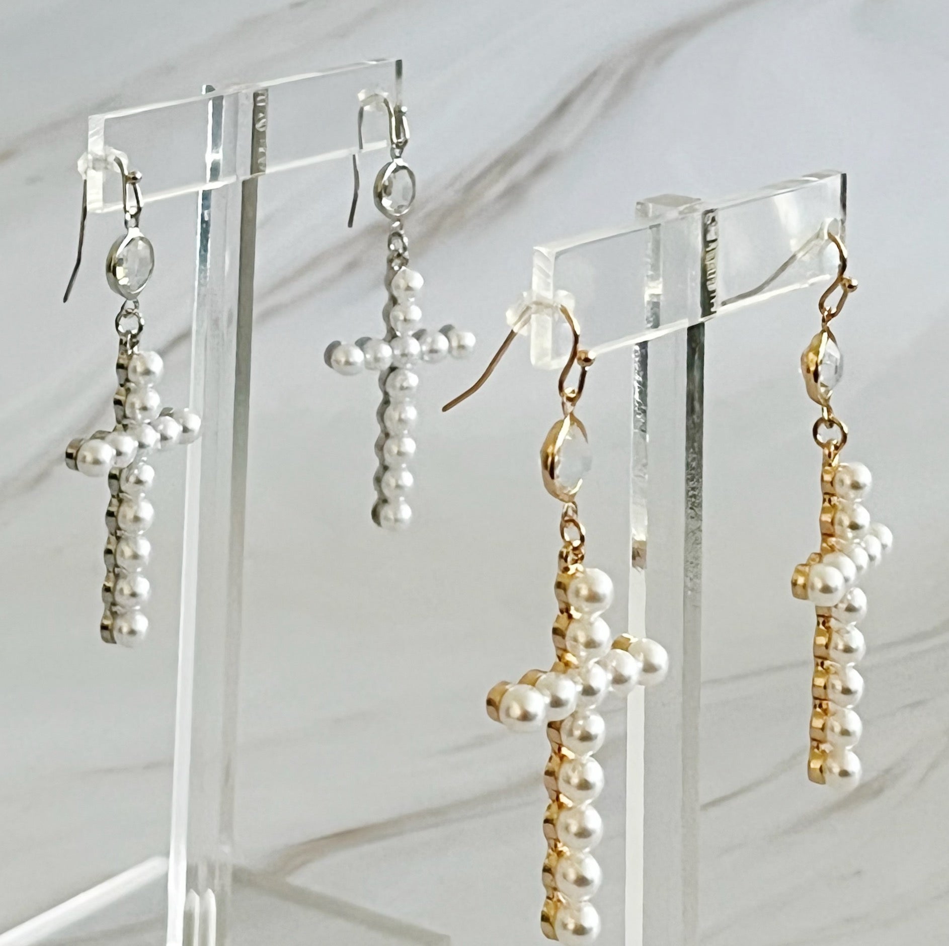 Elegant Pearl Cross Dangle Earrings featuring pearl accents and a unique cross design, perfect for any occasion.