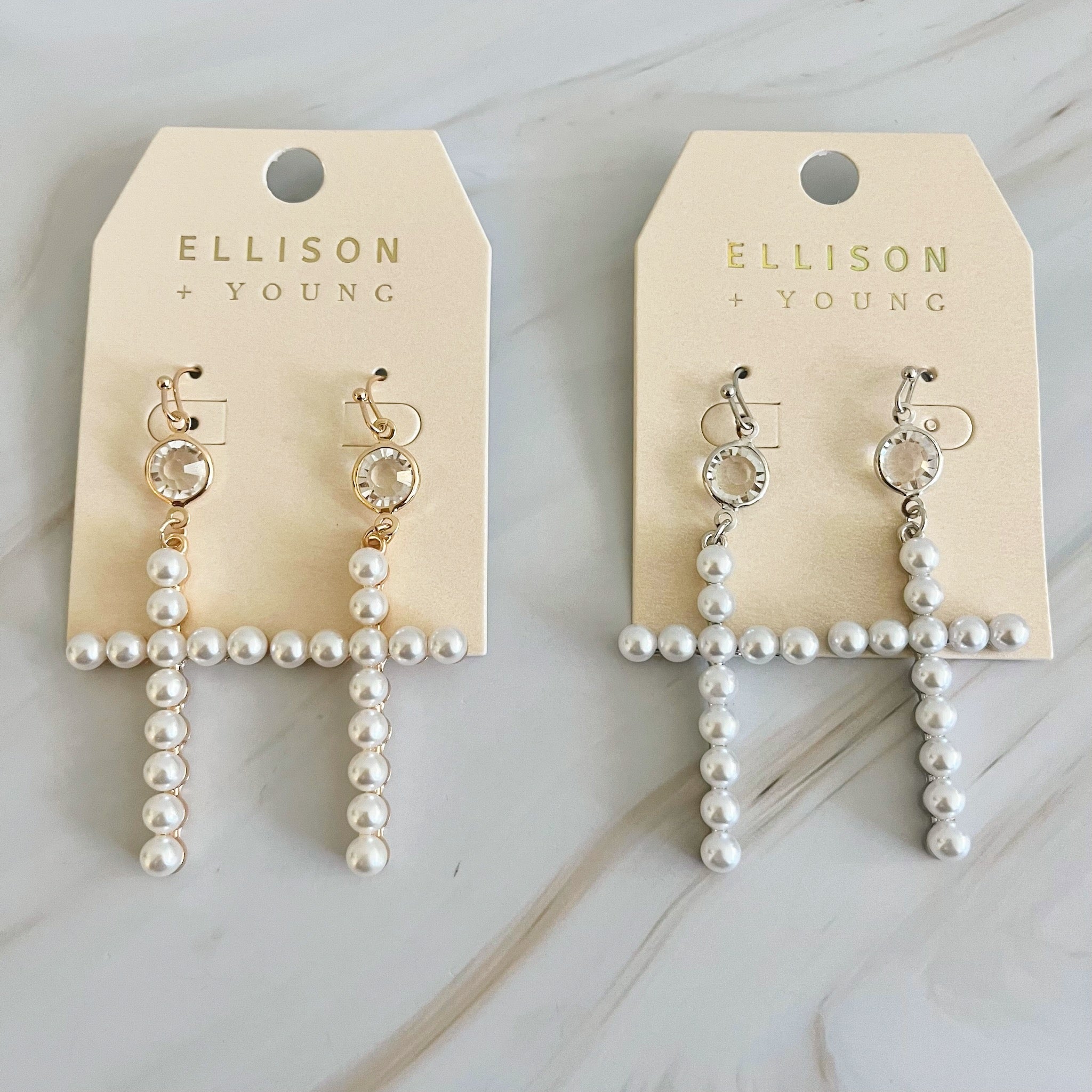 Elegant Pearl Cross Dangle Earrings featuring pearl accents and a unique cross design, perfect for any occasion.