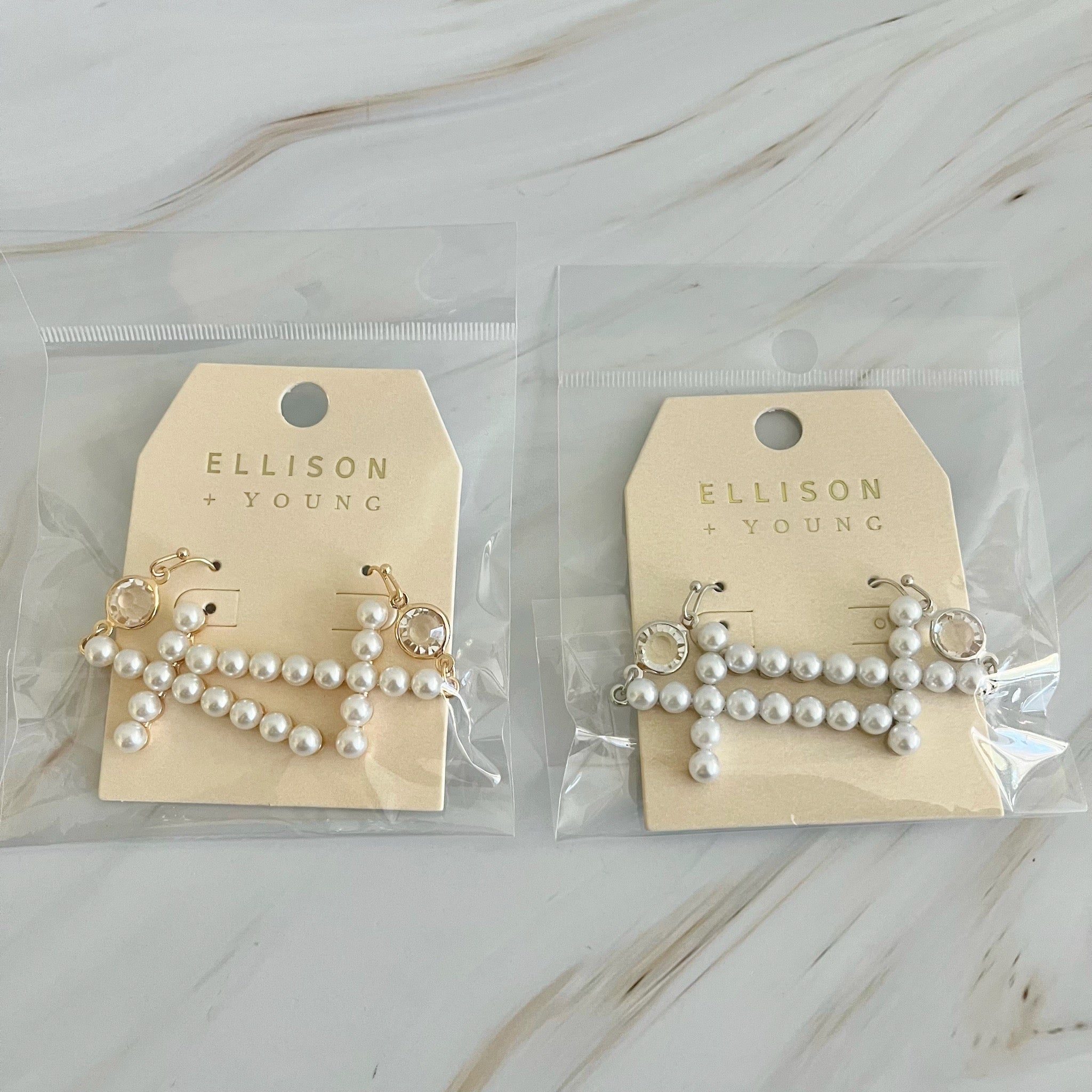 Elegant Pearl Cross Dangle Earrings featuring pearl accents and a unique cross design, perfect for any occasion.