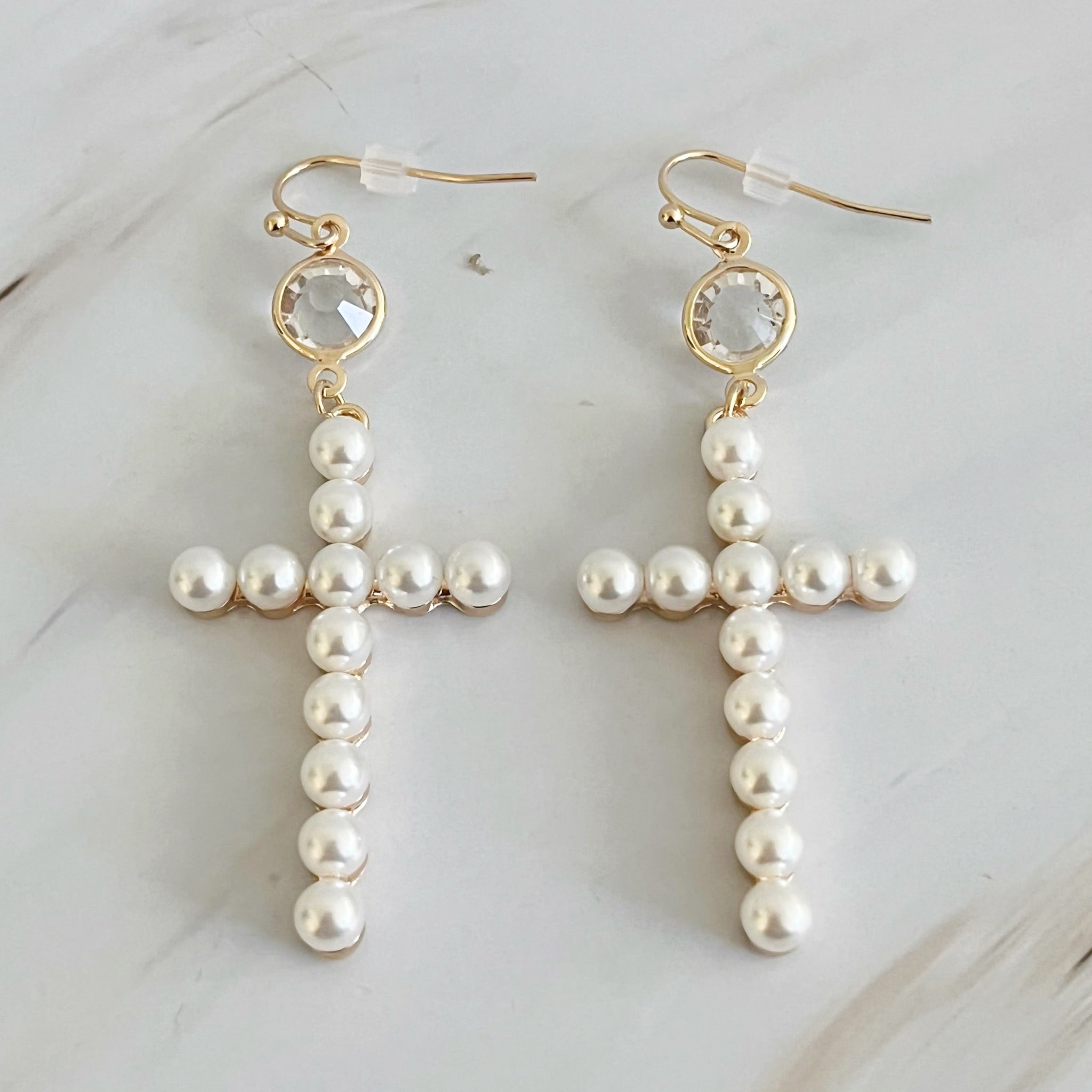 Elegant Pearl Cross Dangle Earrings featuring pearl accents and a unique cross design, perfect for any occasion.