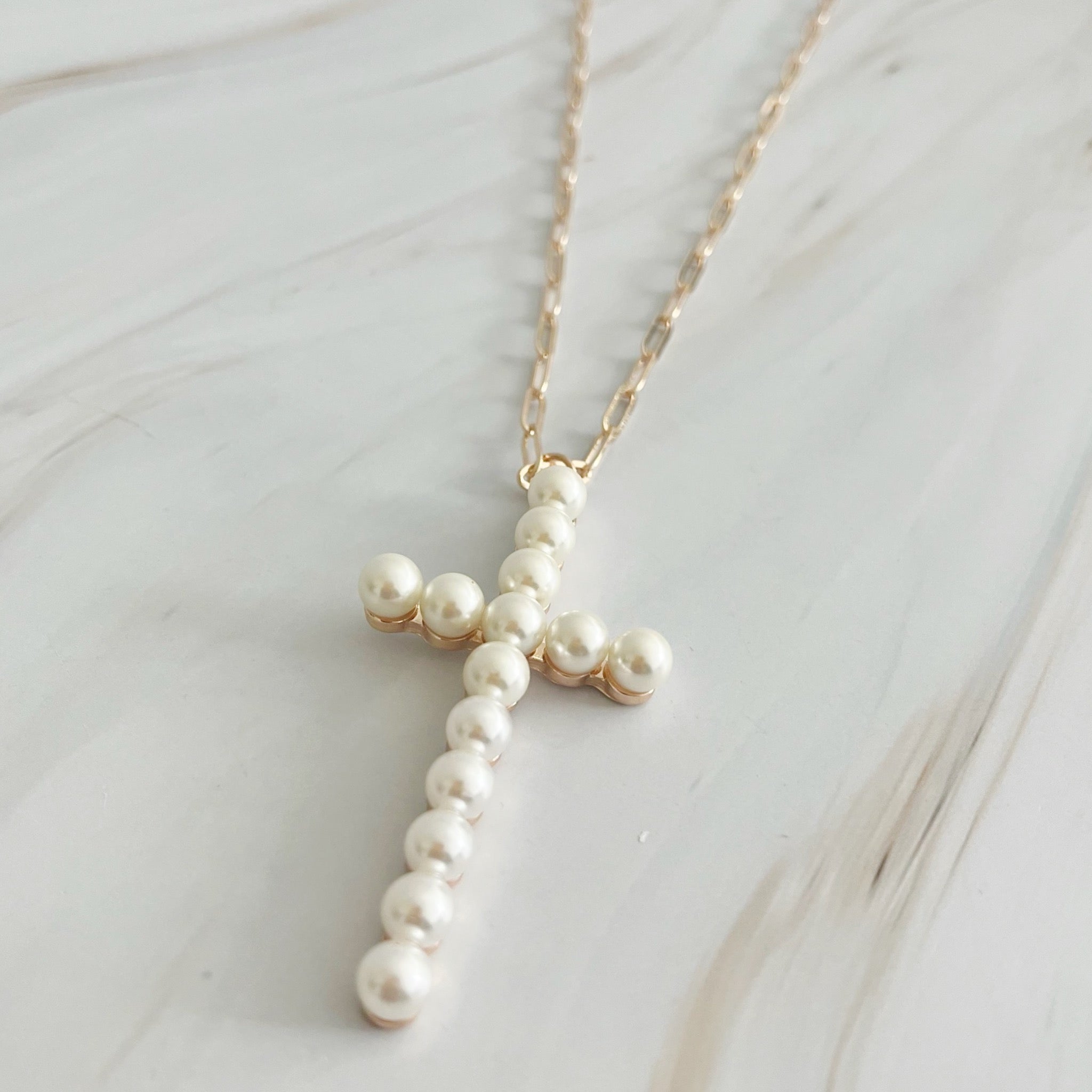 Elegant Pearl Cross Pendant Clip Chain Necklace featuring a bold pearl cross and slim link chain, perfect for everyday wear.