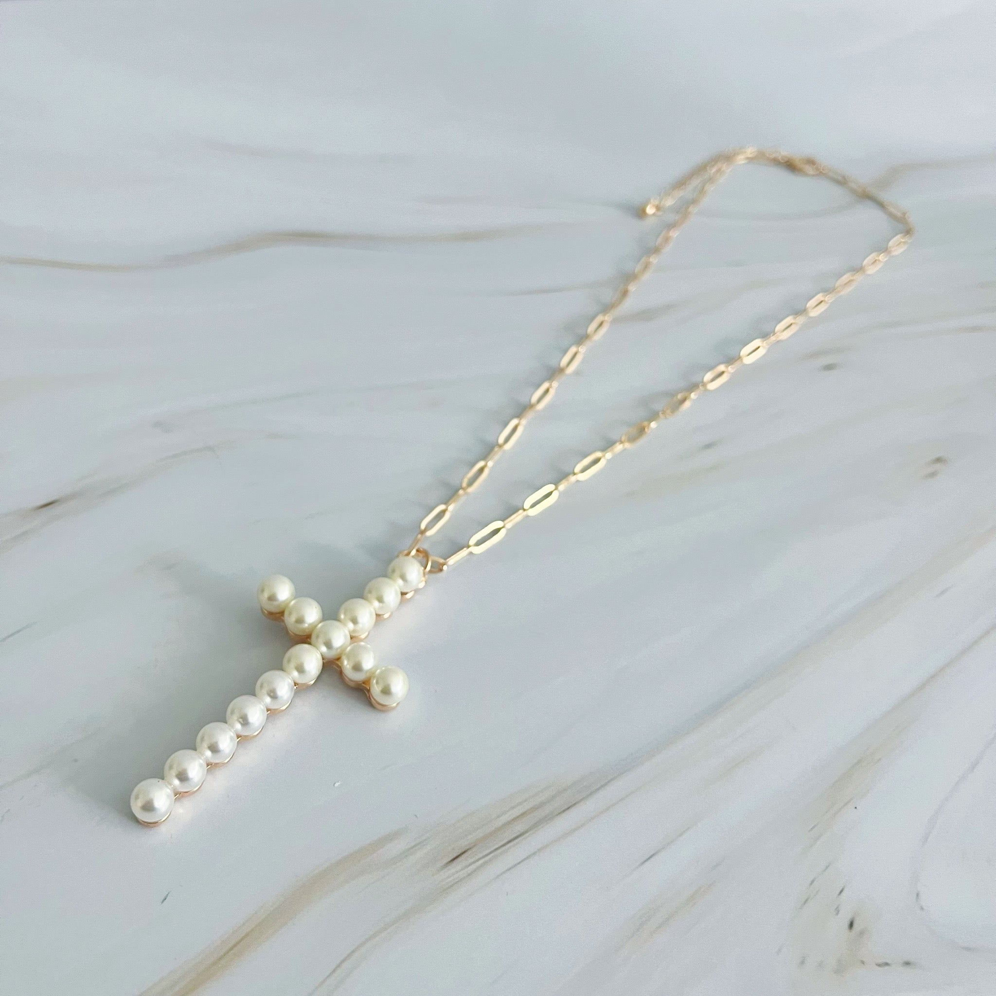 Elegant Pearl Cross Pendant Clip Chain Necklace featuring a bold pearl cross and slim link chain, perfect for everyday wear.