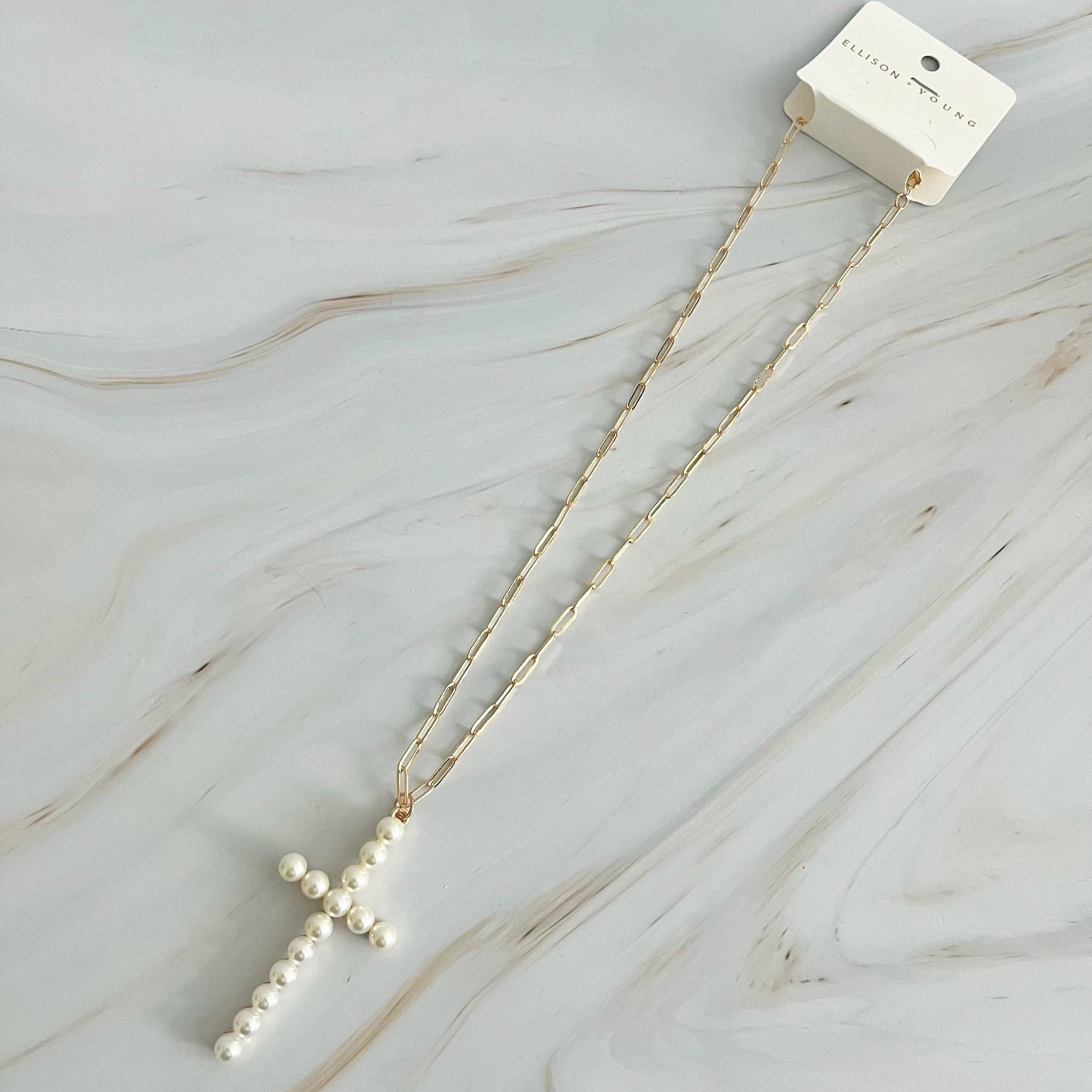 Elegant Pearl Cross Pendant Clip Chain Necklace featuring a bold pearl cross and slim link chain, perfect for everyday wear.