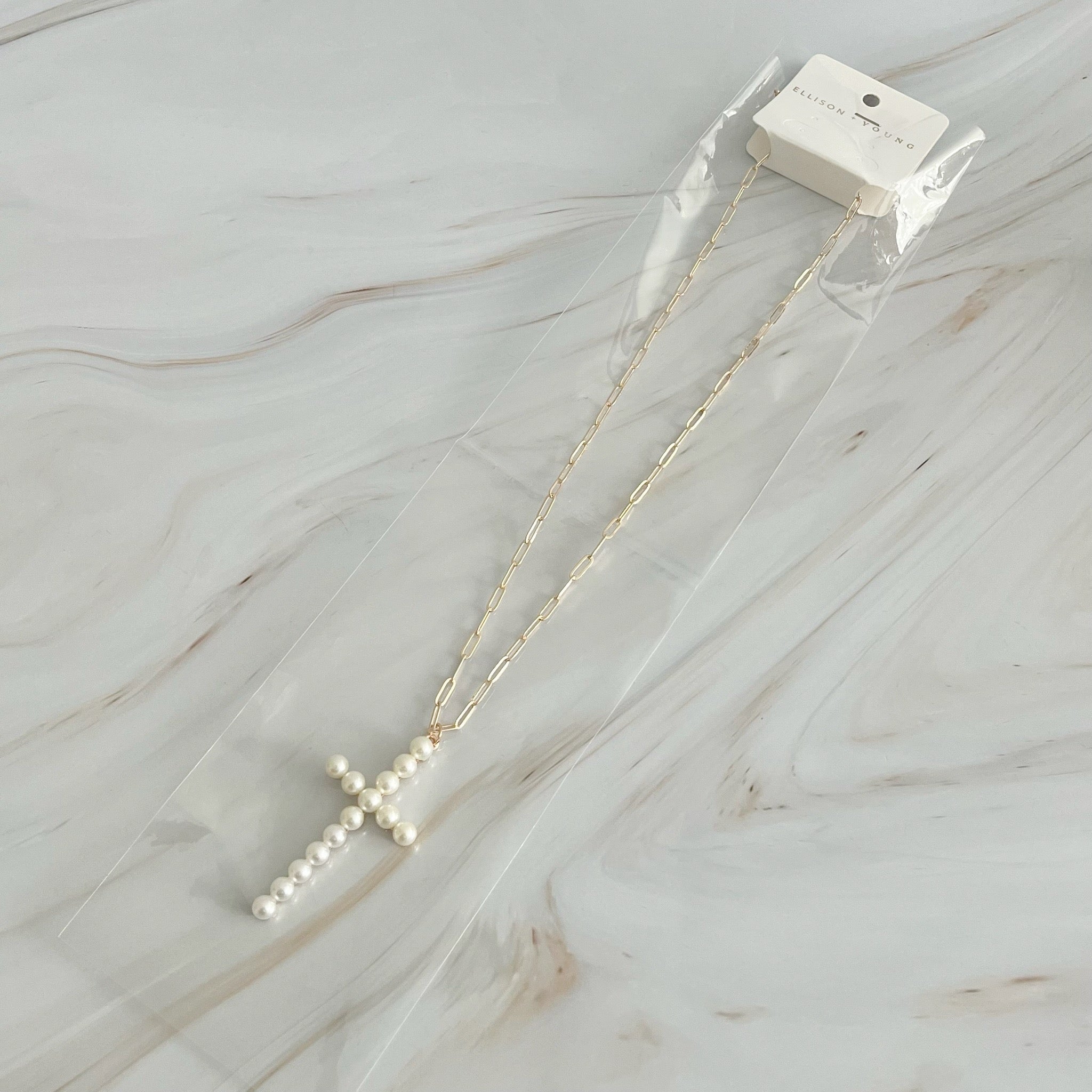 Elegant Pearl Cross Pendant Clip Chain Necklace featuring a bold pearl cross and slim link chain, perfect for everyday wear.