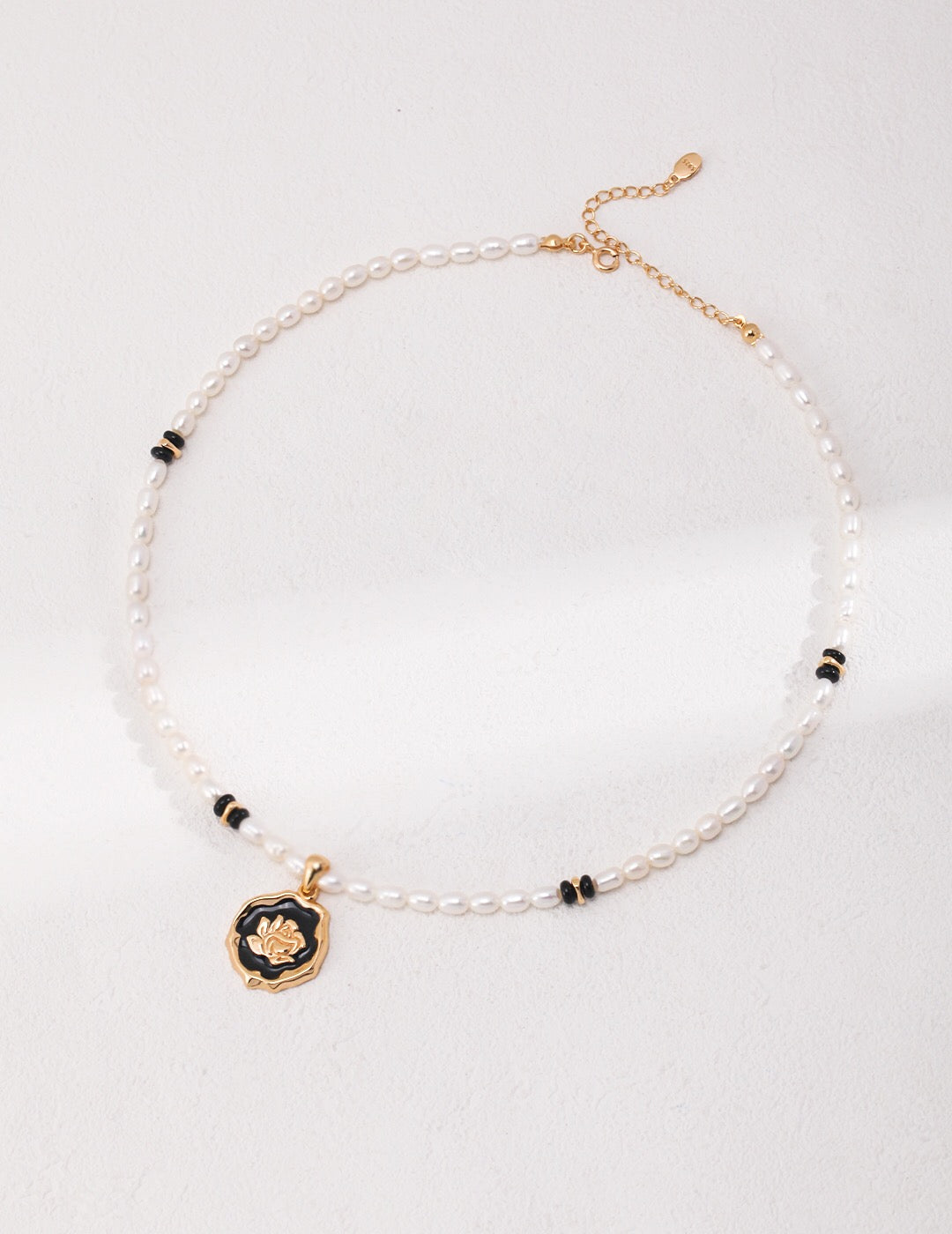 Elegant Pearl Onyx Stone Natural Pearl Necklace featuring natural pearls, black agate, and gold vermeil accents, displayed on a soft background.