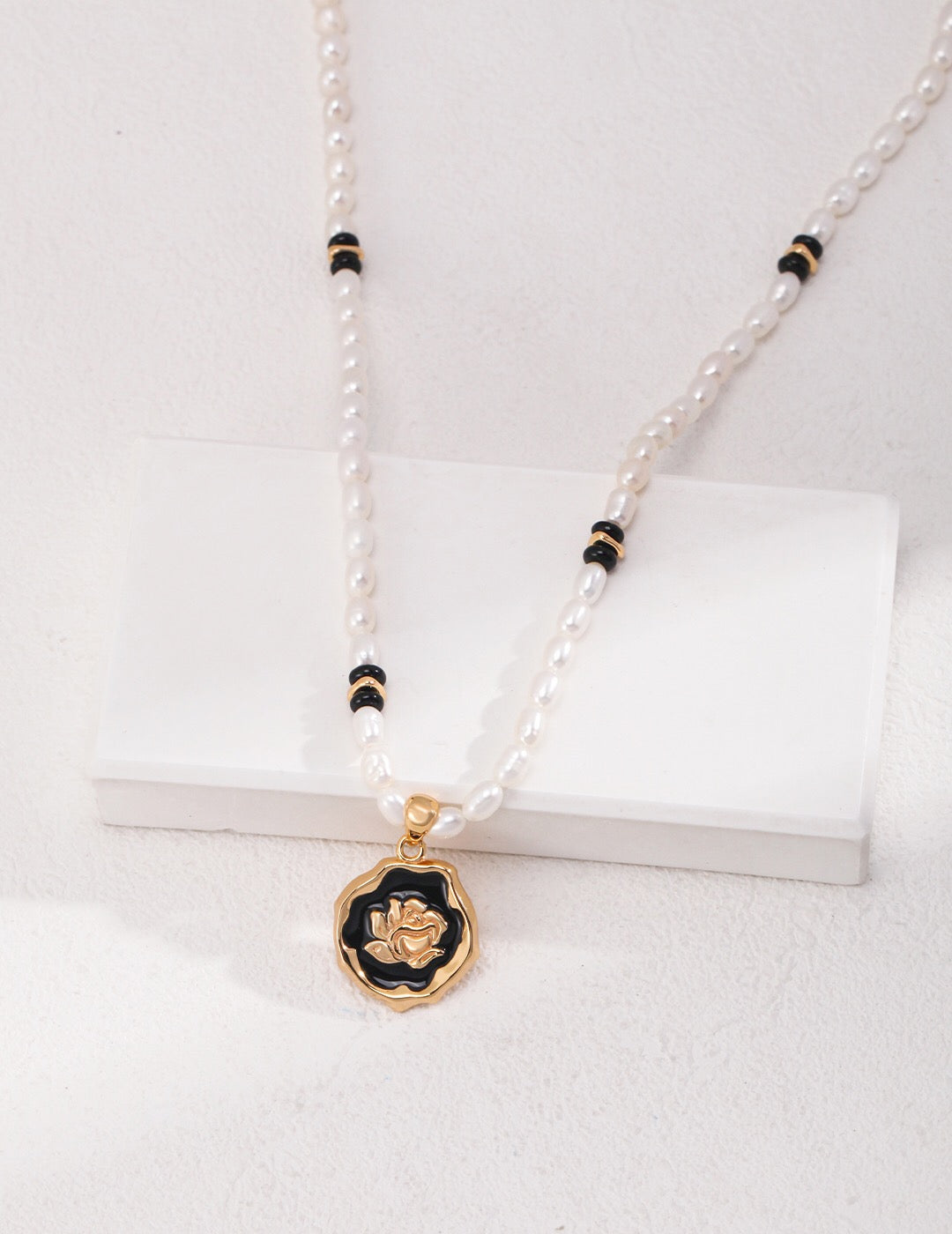 Elegant Pearl Onyx Stone Natural Pearl Necklace featuring natural pearls, black agate, and gold vermeil accents, displayed on a soft background.