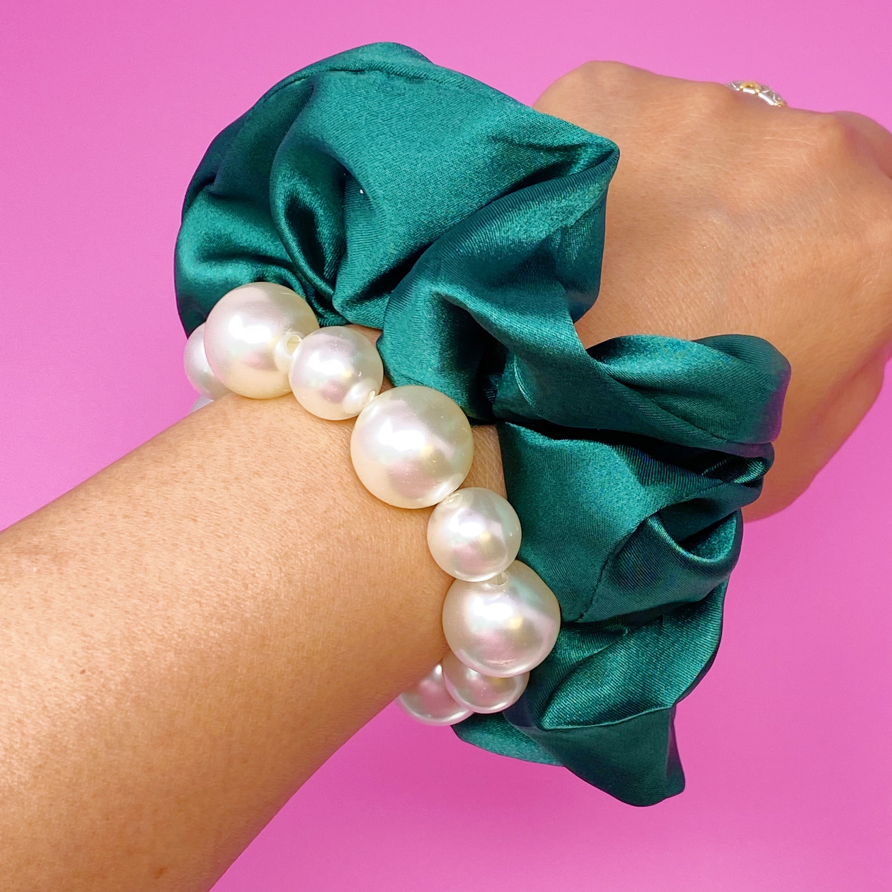 A stylish Pearl & Satin Scrunchie Set featuring elegant satin fabric and pearl accents, perfect for any hairstyle.