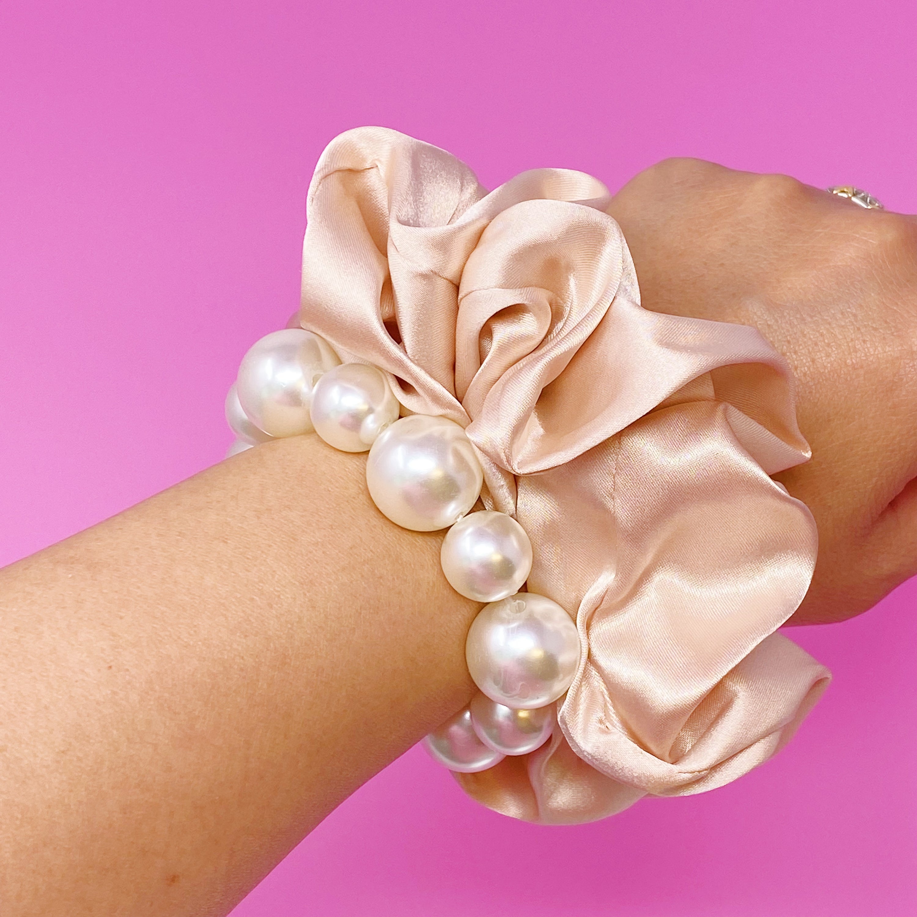 A stylish Pearl & Satin Scrunchie Set featuring elegant satin fabric and pearl accents, perfect for any hairstyle.