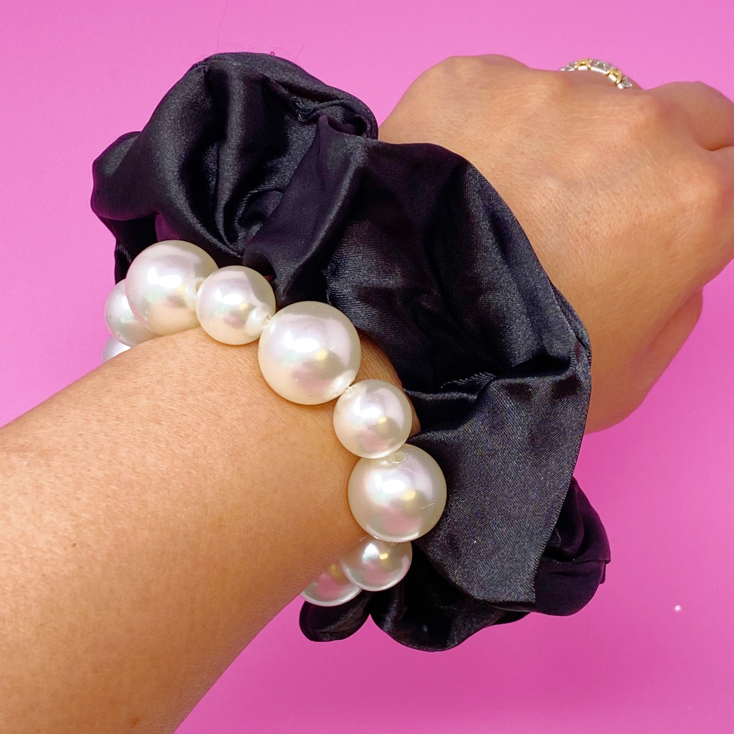 A stylish Pearl & Satin Scrunchie Set featuring elegant satin fabric and pearl accents, perfect for any hairstyle.