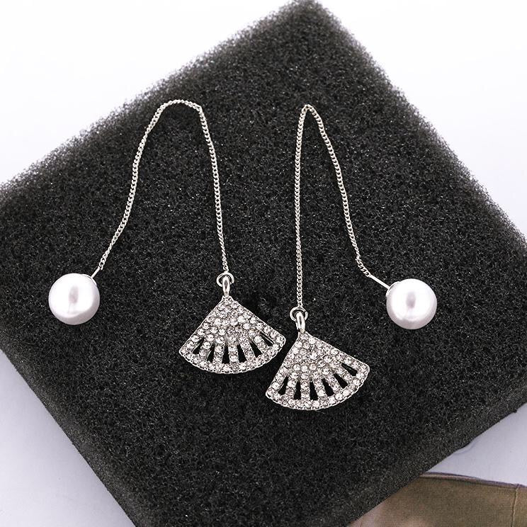 Elegant pearl stud earrings with long chained rhinestone fan design, showcasing a blend of sophistication and modern style.