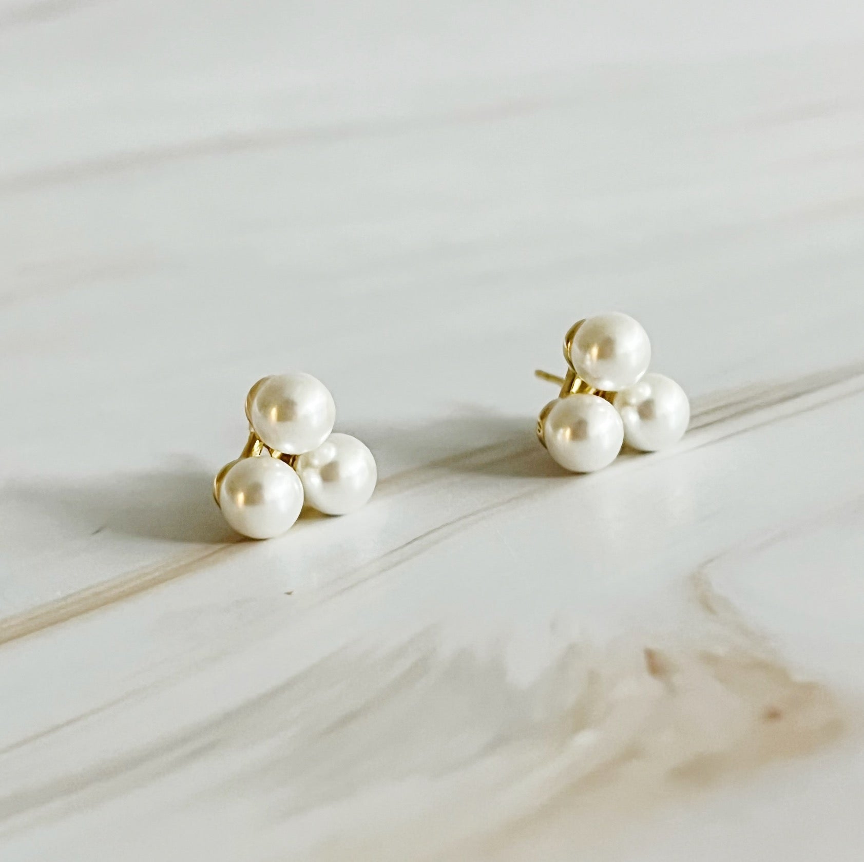 Elegant Pearl Trio Stud Earrings featuring three glass pearls set in 18k gold plated brass, perfect for any occasion.