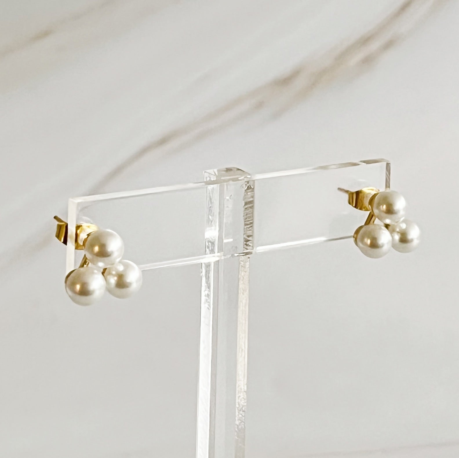 Elegant Pearl Trio Stud Earrings featuring three glass pearls set in 18k gold plated brass, perfect for any occasion.