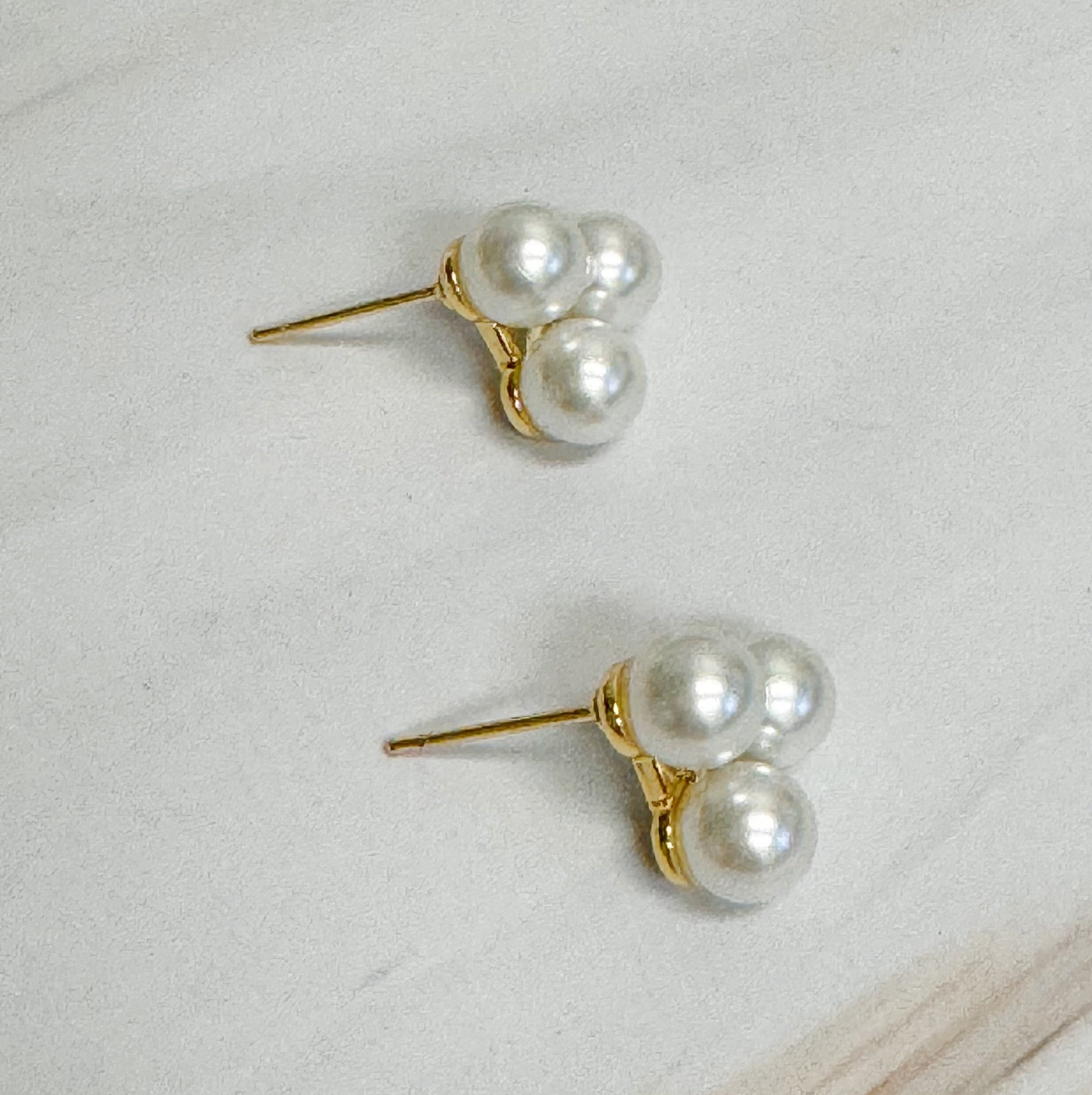 Elegant Pearl Trio Stud Earrings featuring three glass pearls set in 18k gold plated brass, perfect for any occasion.