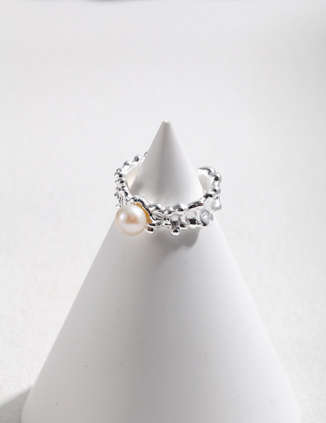 A stunning Pearl Wave Adjustable Ring featuring a freshwater pearl set in tarnish-resistant sterling silver with gold vermeil accents.