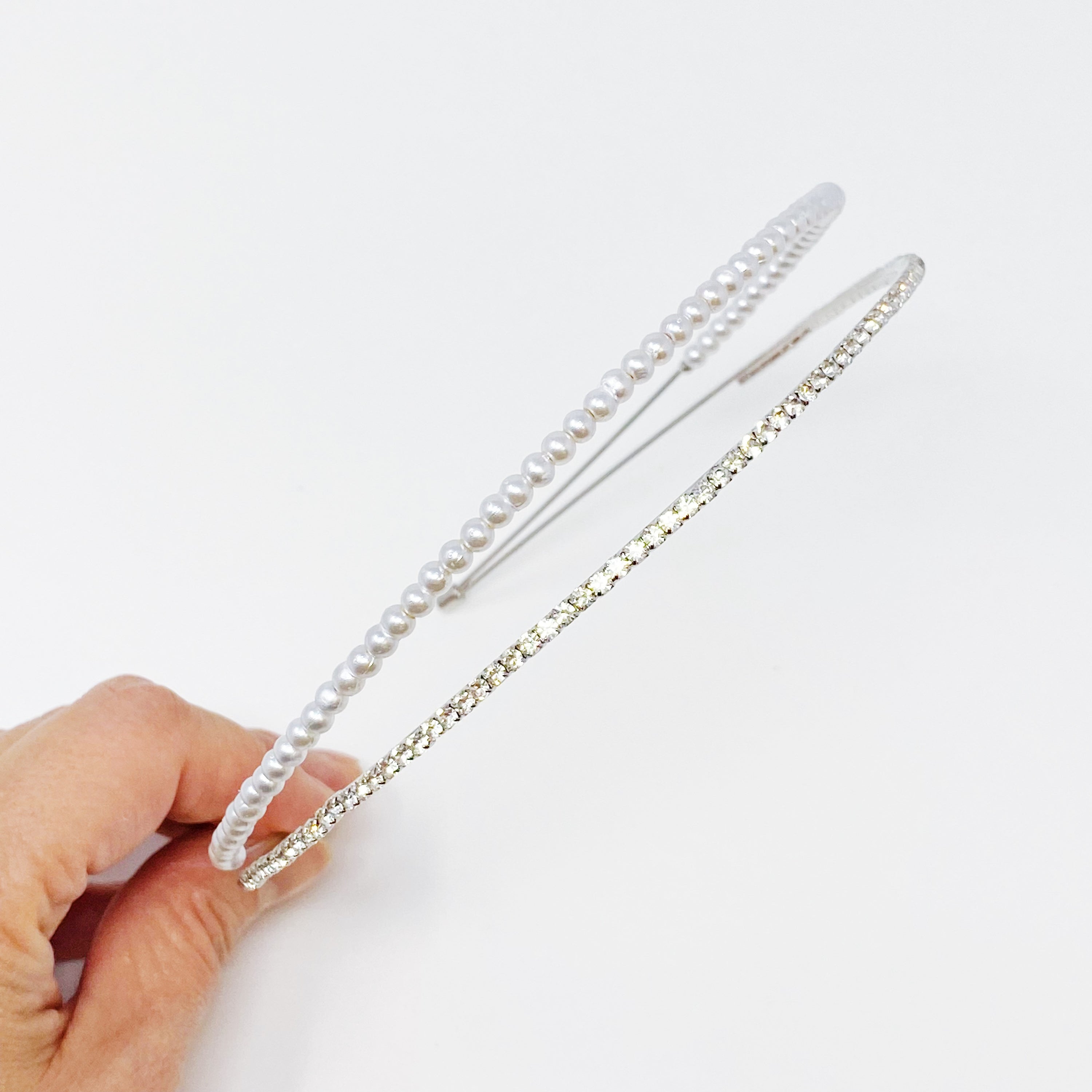 A stylish headband featuring glass pearls and rhinestones, perfect for girls' accessories.