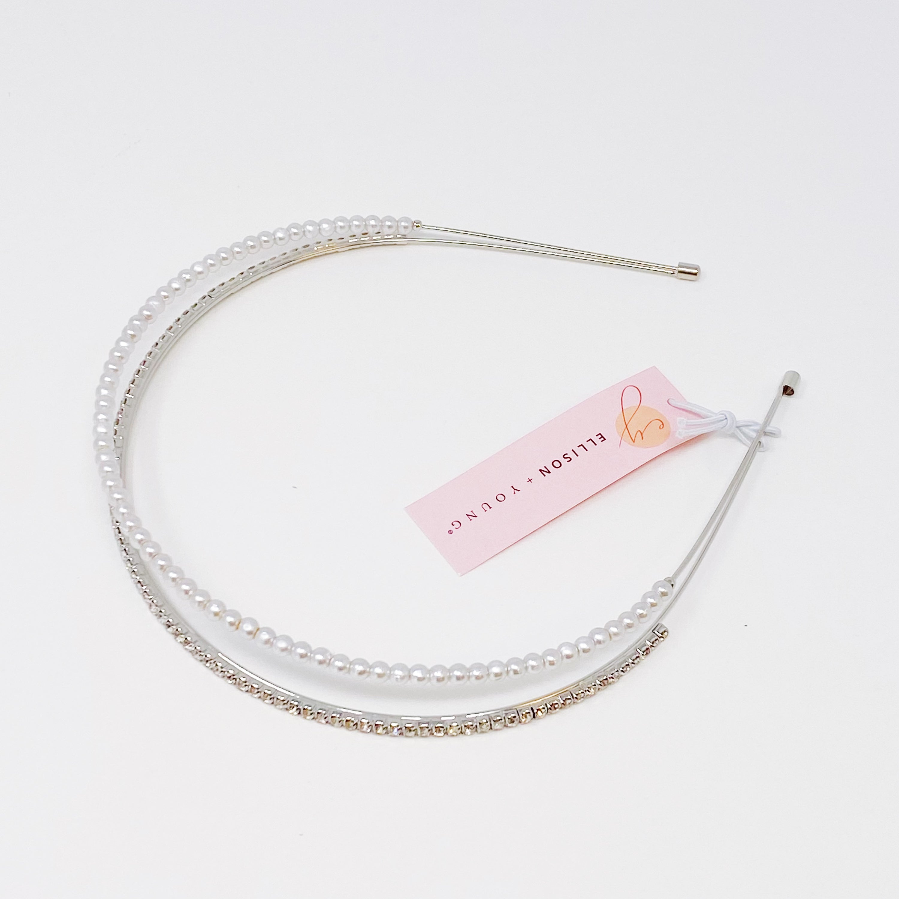 A stylish headband featuring glass pearls and rhinestones, perfect for girls' accessories.