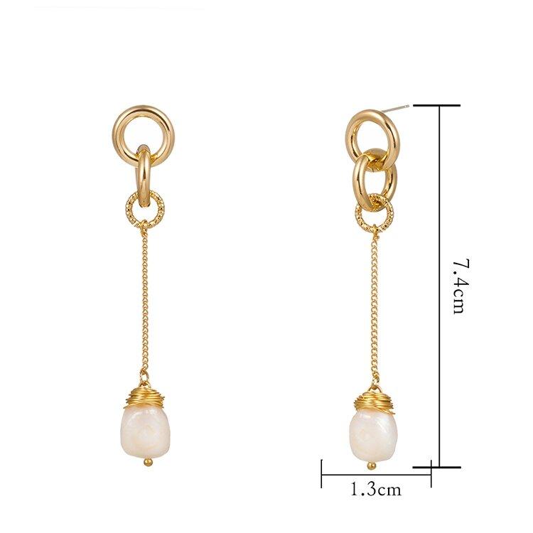 Elegant gold drop earrings featuring unique Baroque freshwater pearls and sparkling cubic zirconia, perfect for any occasion.