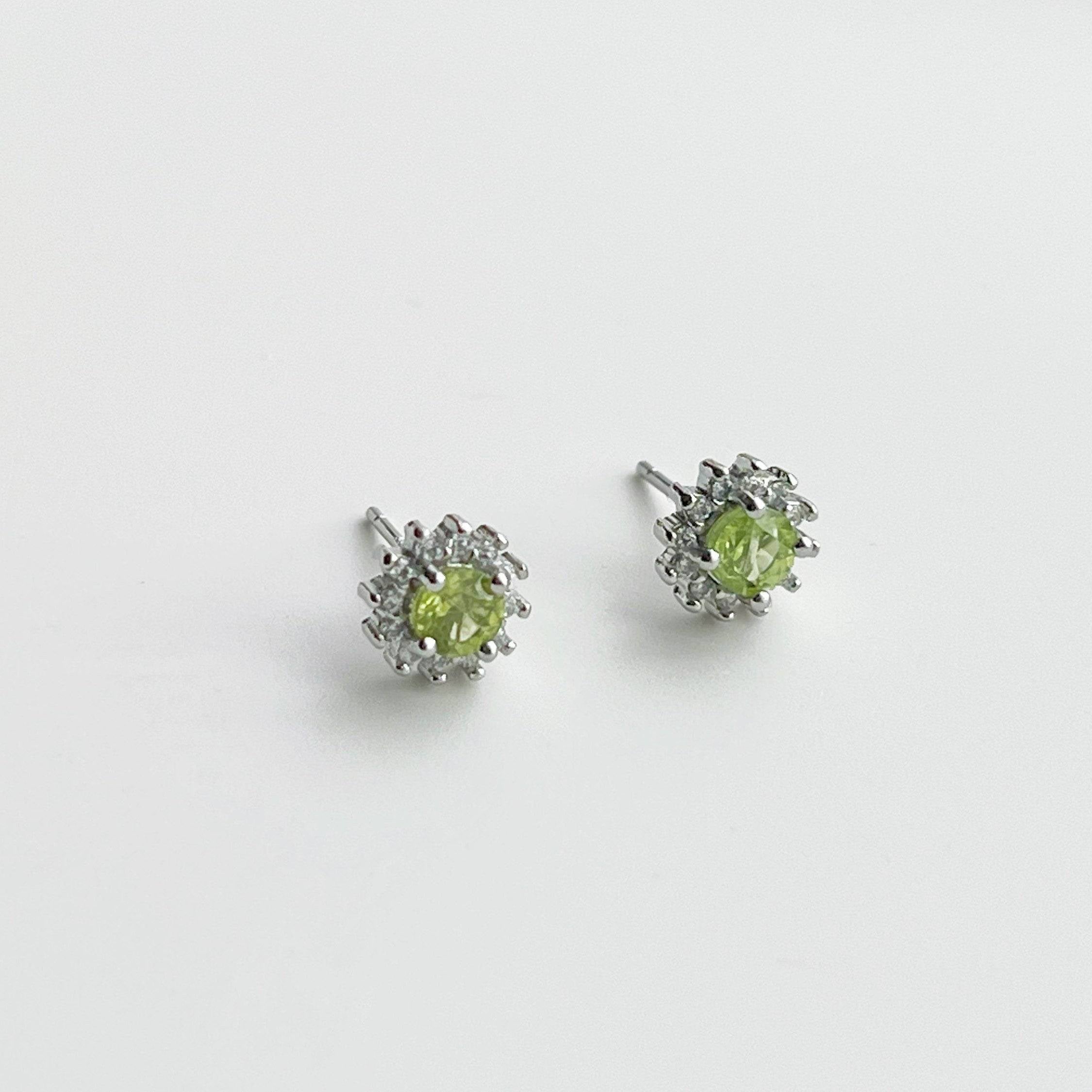 Elegant Peridot Earrings featuring natural green gemstones set in sterling silver, perfect for August birthdays.