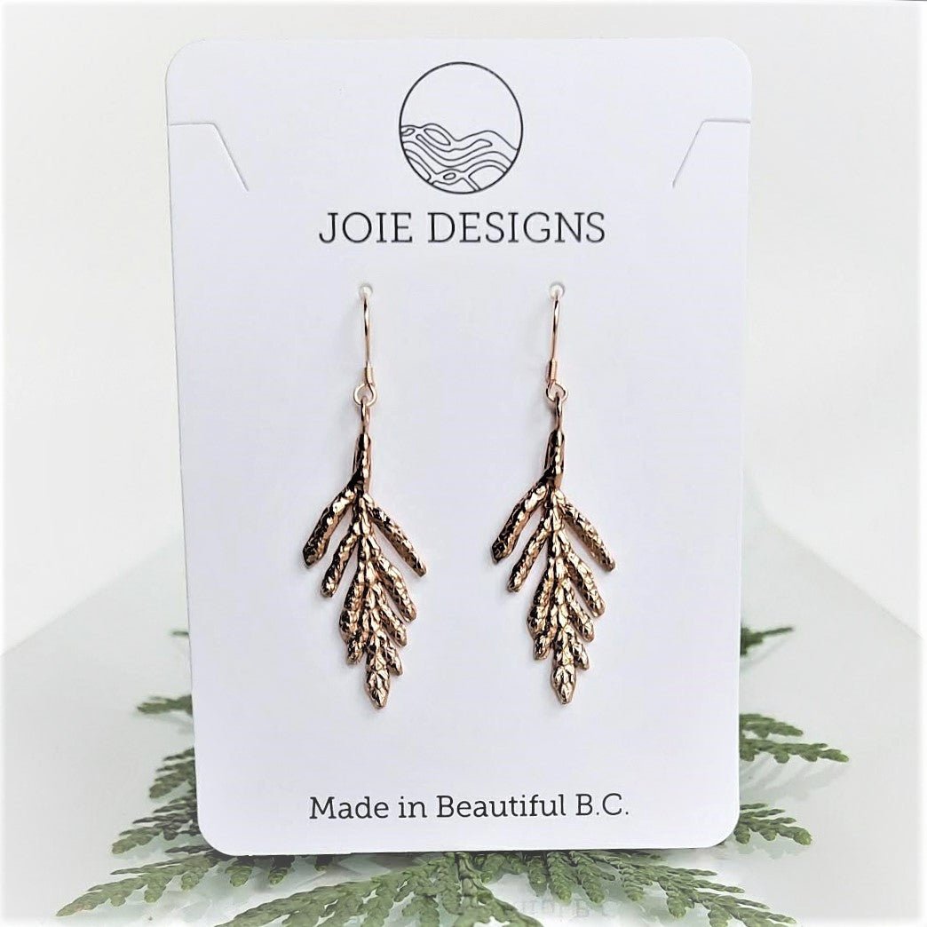 Petite Arborvitae Cedar Leaf Dangle Earrings in sterling silver, showcasing intricate leaf design.