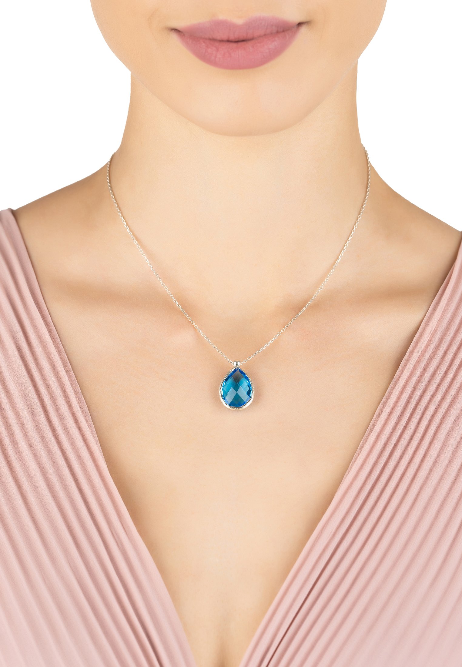 Petite Drop Necklace featuring a teardrop Blue Topaz gemstone set in 925 sterling silver, showcasing elegance and vibrant color.