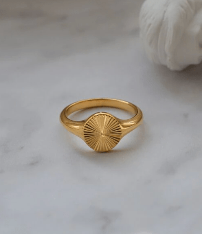 Peyton Geometric Starburst Ring in gold, showcasing a minimalist design with sun rays burst pattern, perfect for modern and vintage styles.