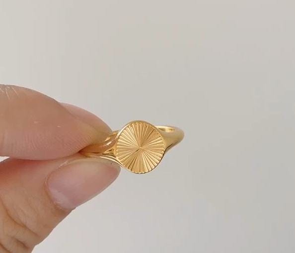 Peyton Geometric Starburst Ring in gold, showcasing a minimalist design with sun rays burst pattern, perfect for modern and vintage styles.