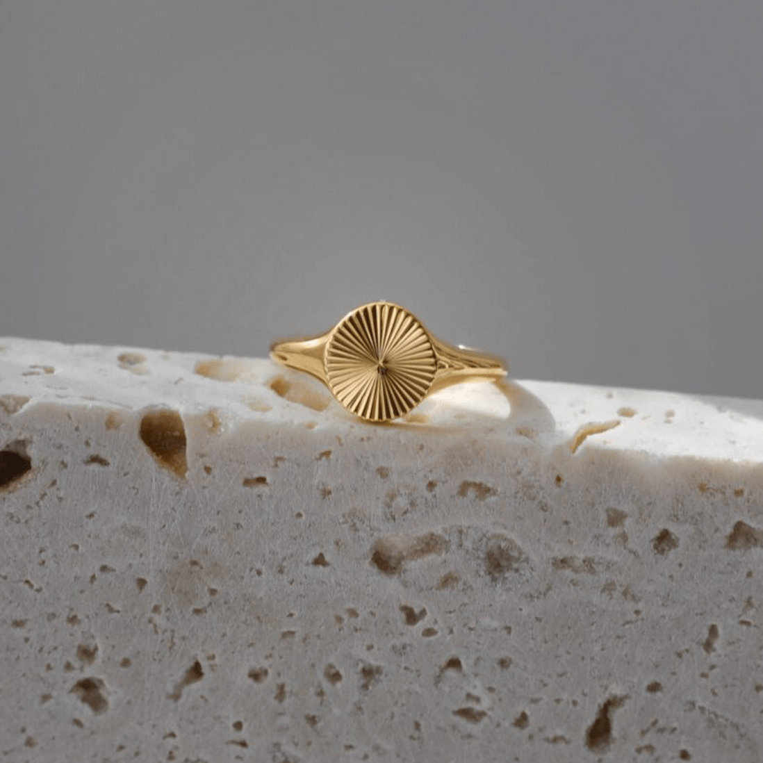 Peyton Geometric Starburst Ring in gold, showcasing a minimalist design with sun rays burst pattern, perfect for modern and vintage styles.