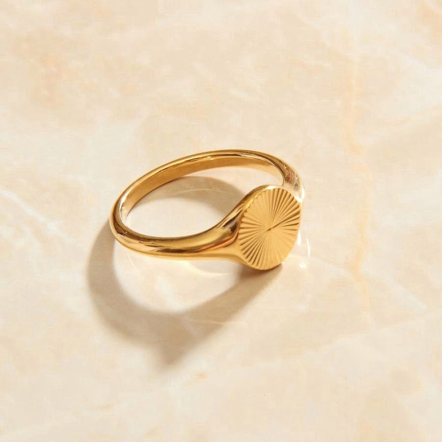 Peyton Geometric Starburst Ring in gold, showcasing a minimalist design with sun rays burst pattern, perfect for modern and vintage styles.