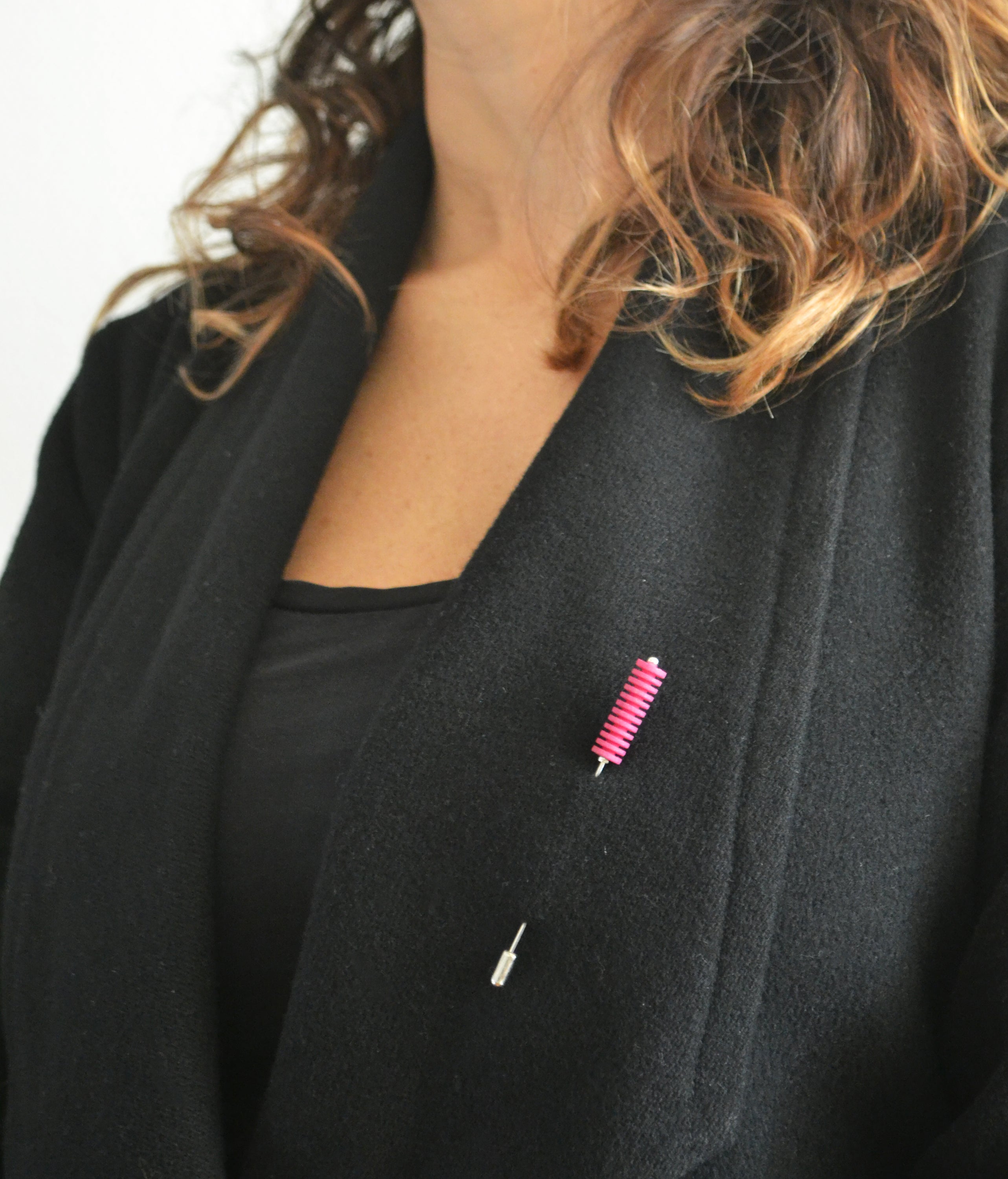 Optical Pin Brooch in various bold colors, showcasing its minimalistic design and versatility as a fashion accessory.